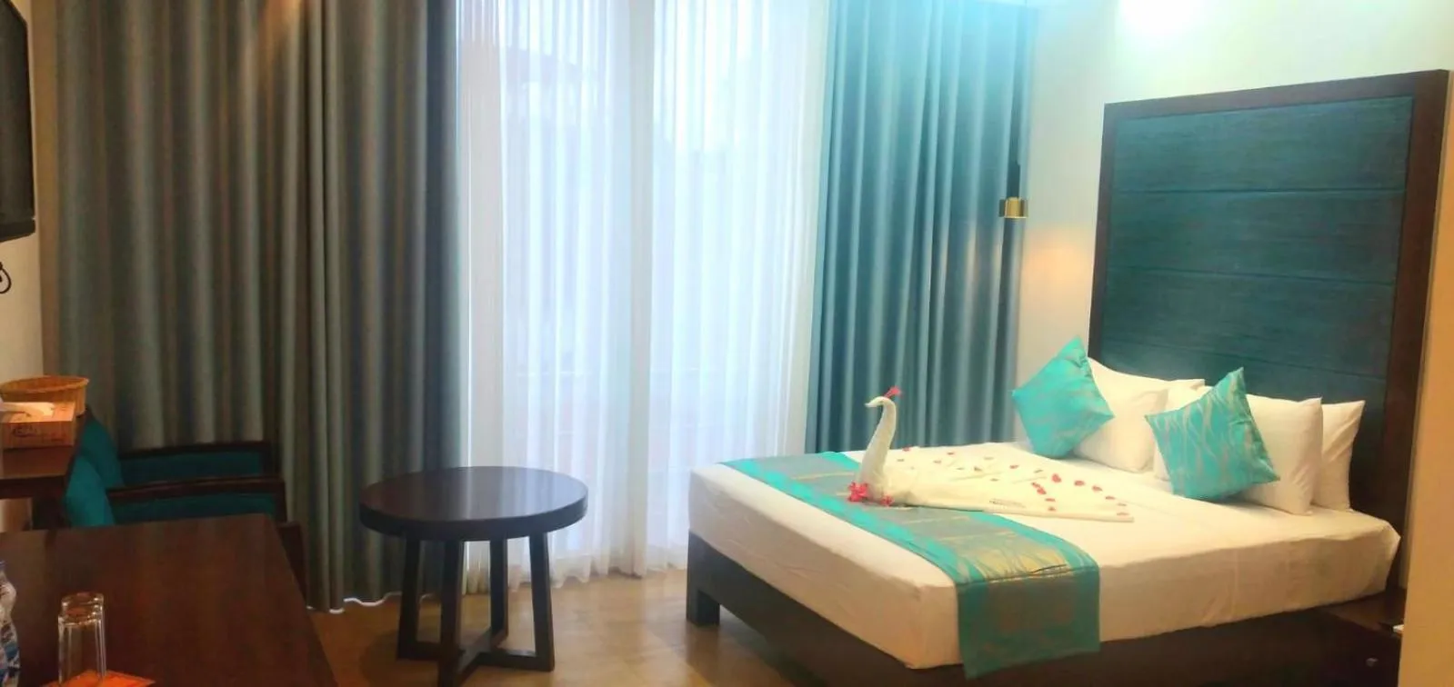 Bed in Grand Samudra Hotel