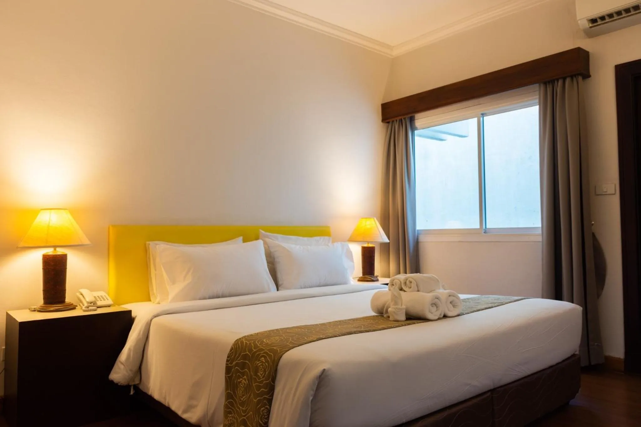 Bed in Mayflower Grand Hotel Korat