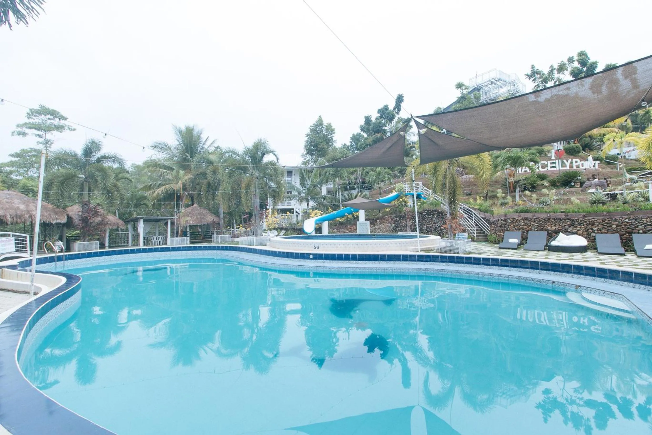 Swimming pool in RedDoorz @ Marceily Point Resort Guimaras