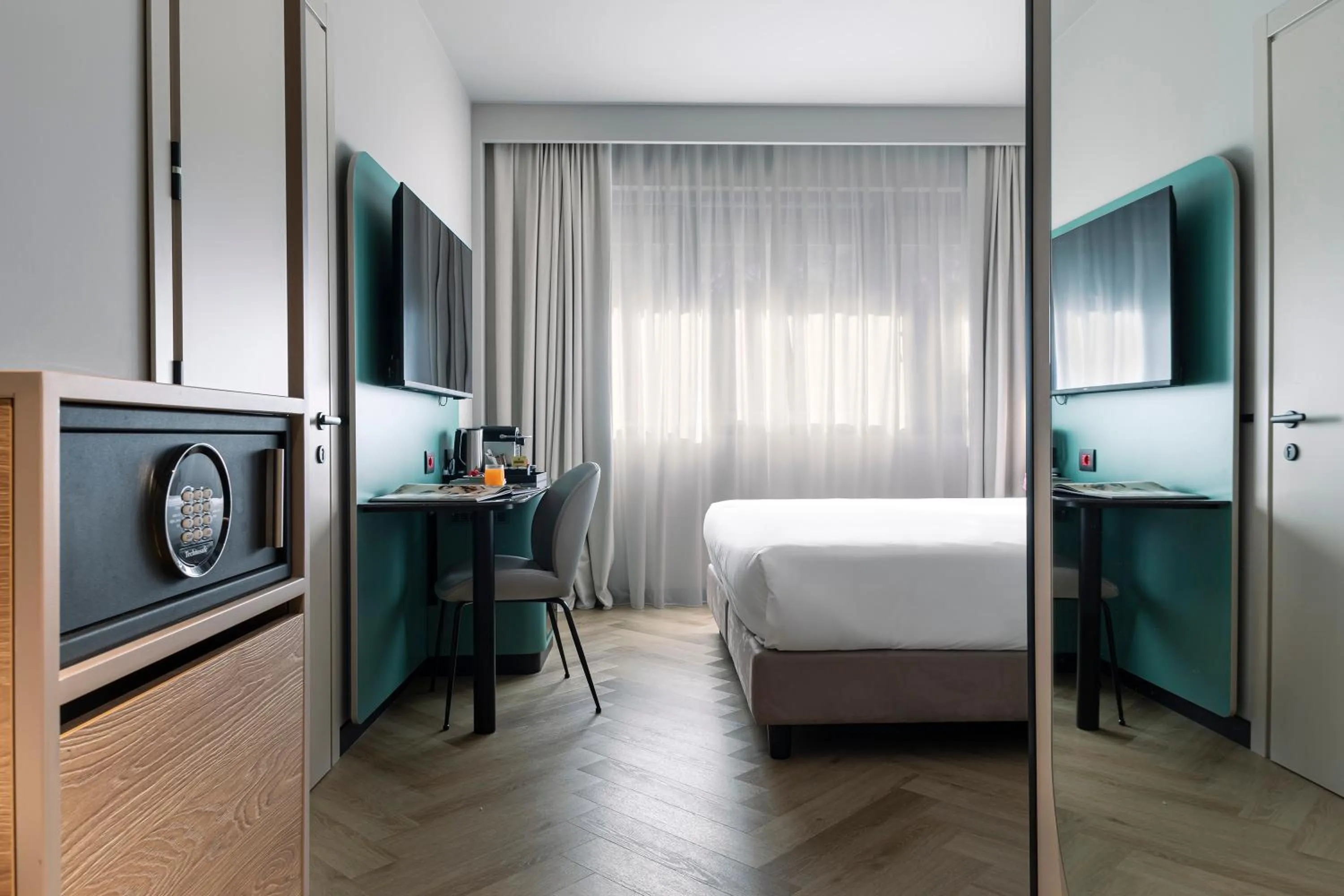 TV and multimedia, Bed in Living Place Hotel