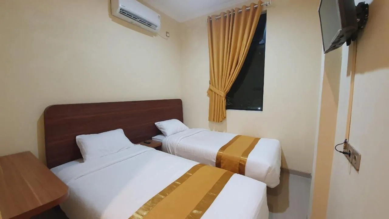 Bedroom, Bed in Harmony Inn Belitung - City Hotel