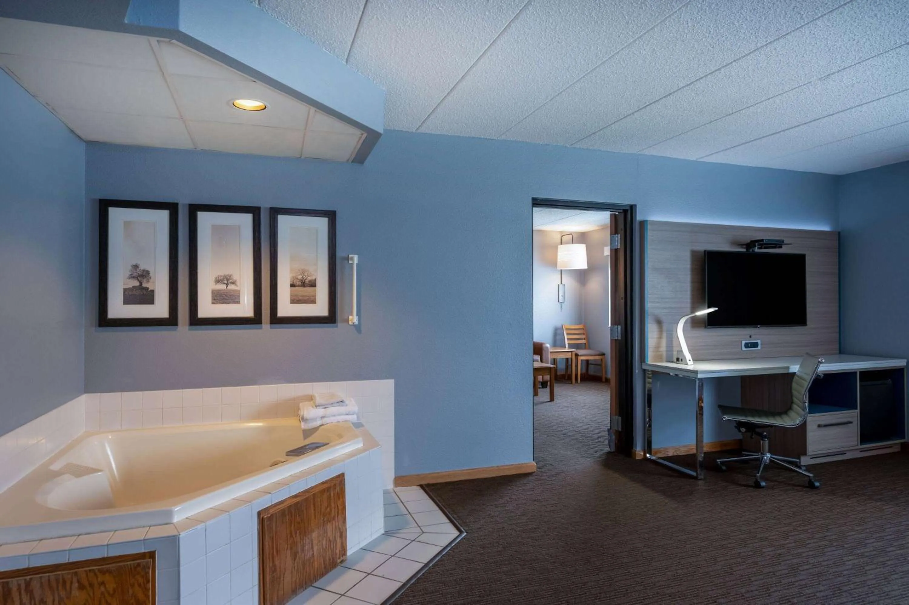 Bed in AmericInn by Wyndham Eau Claire