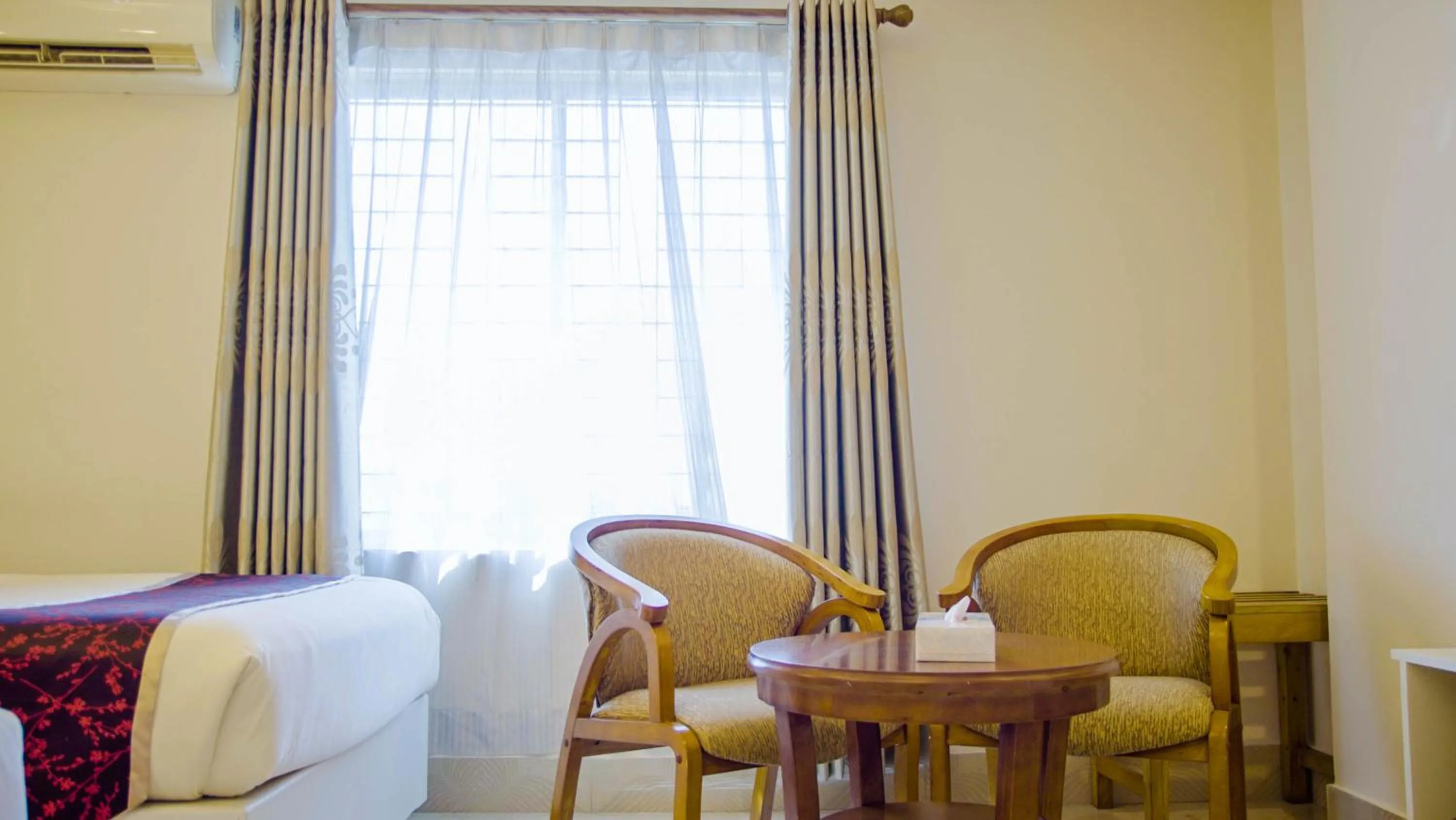 Seating area, Bed in Hotel Shuktara Dhaka