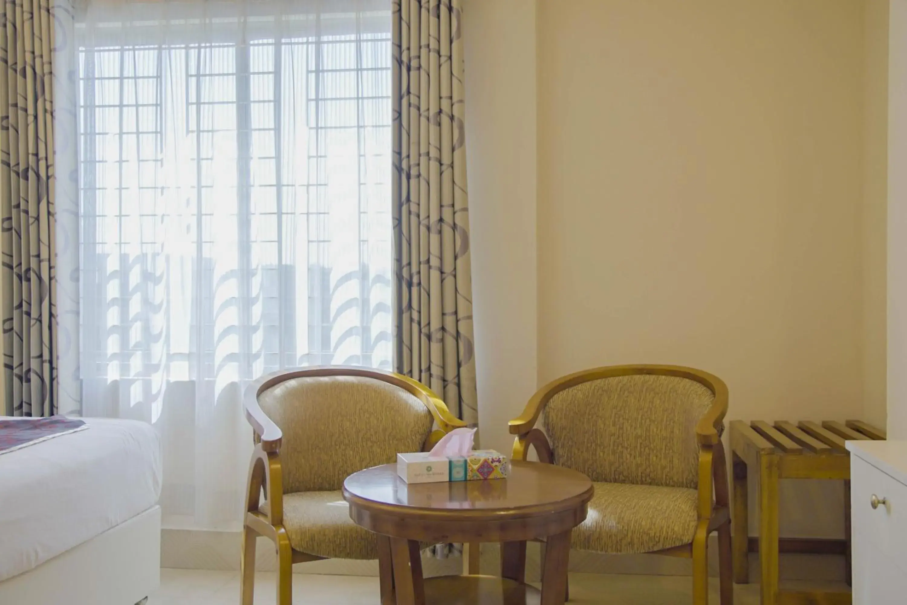 Seating area, Bed in Hotel Shuktara Dhaka Seating area, Bed in Hotel Shuktara Dhaka