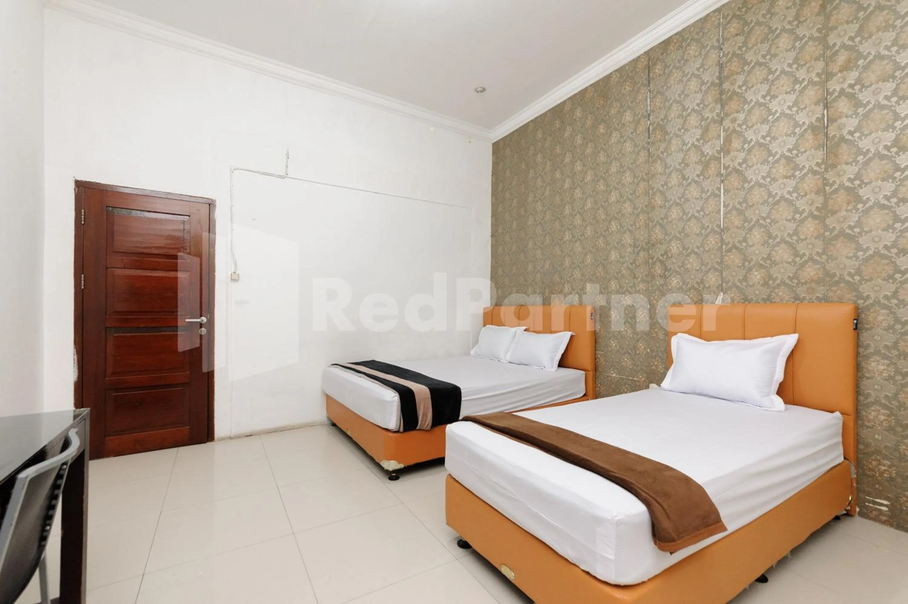 Bed in RedDoorz at Wisma Nabila Syariah near Masjid Raya Baiturrahman Banda Aceh