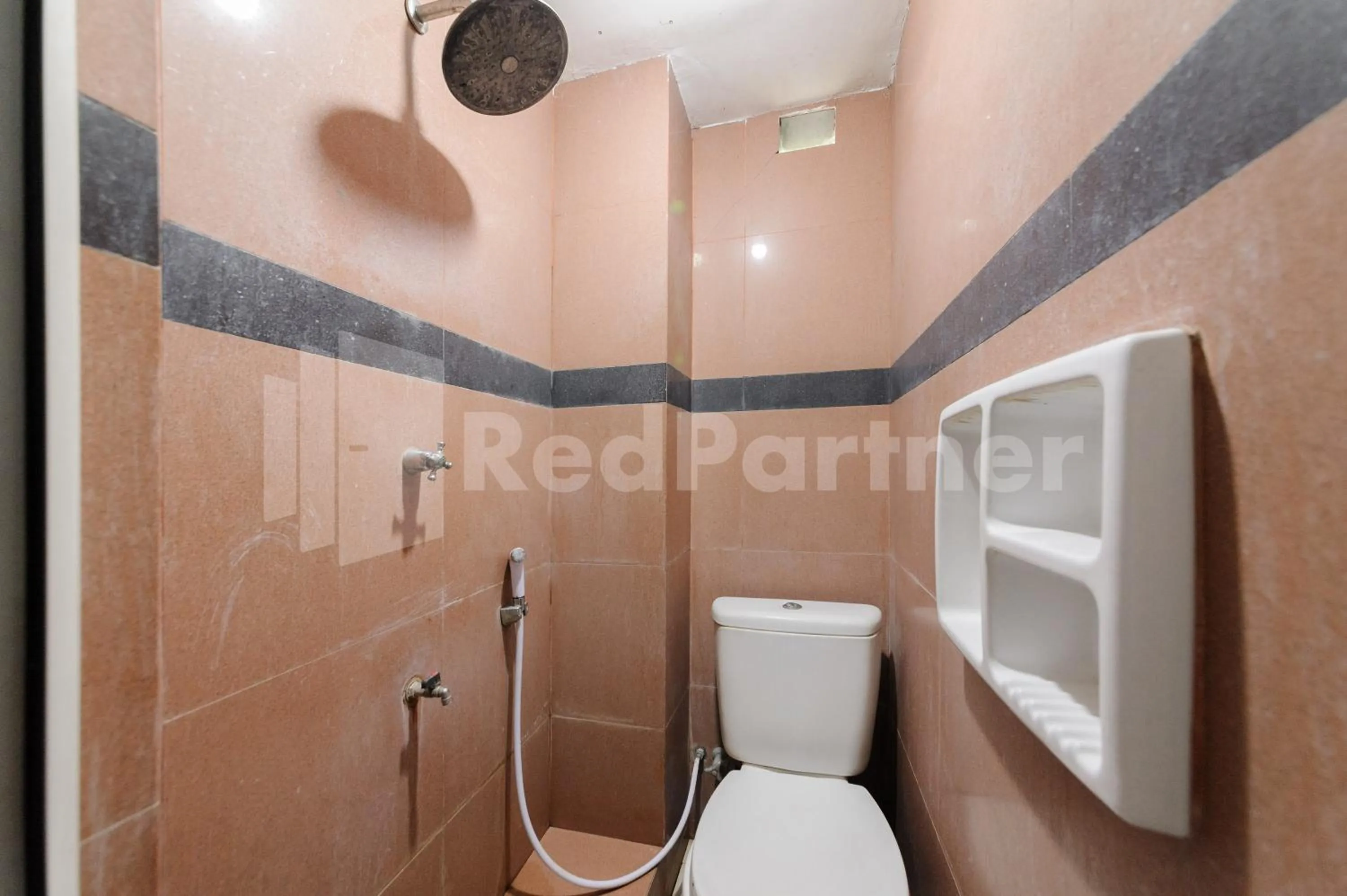 Bathroom in RedDoorz at Wisma Nabila Syariah near Masjid Raya Baiturrahman Banda Aceh