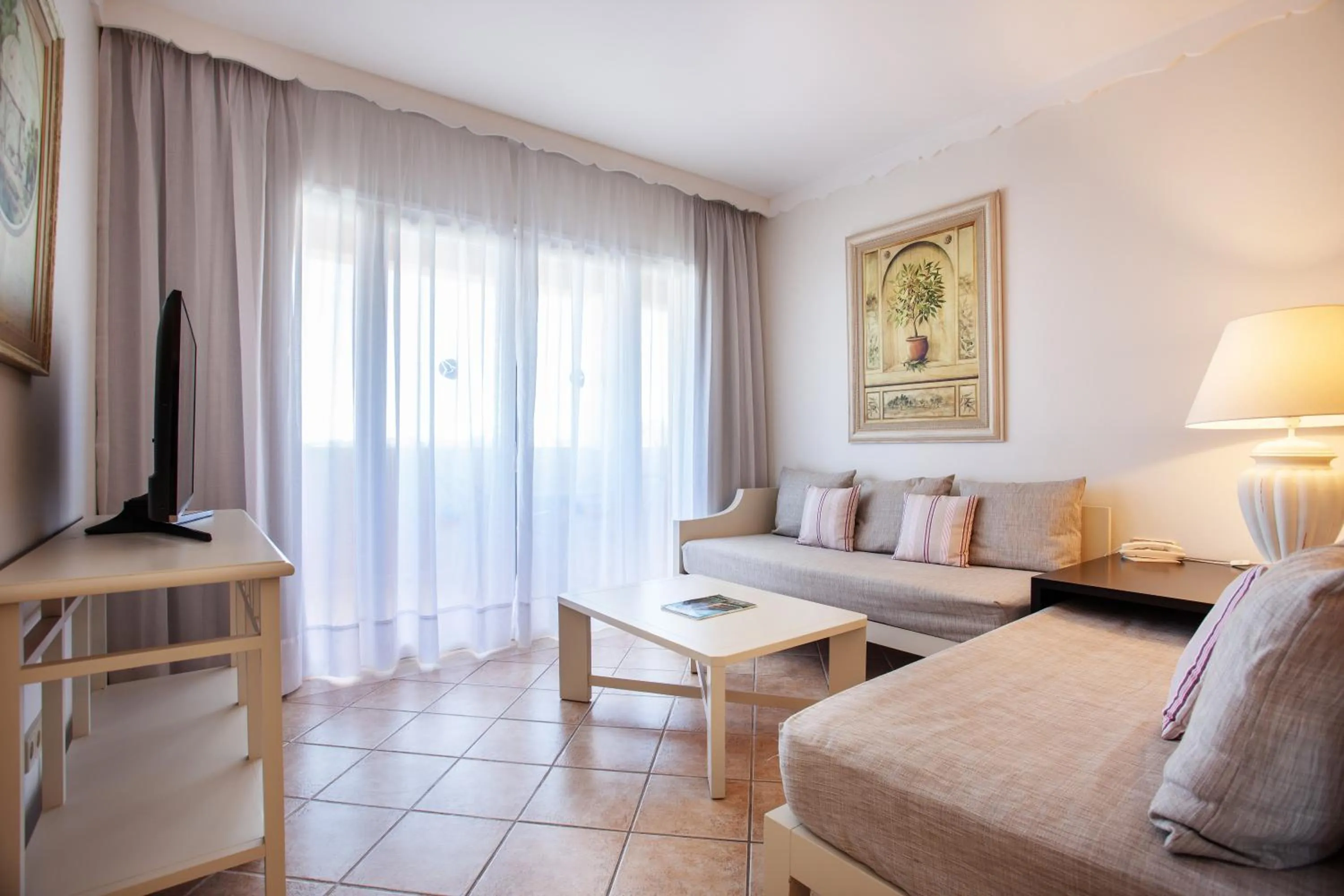 Living room, Bed in Grupotel Macarella Suites & Spa