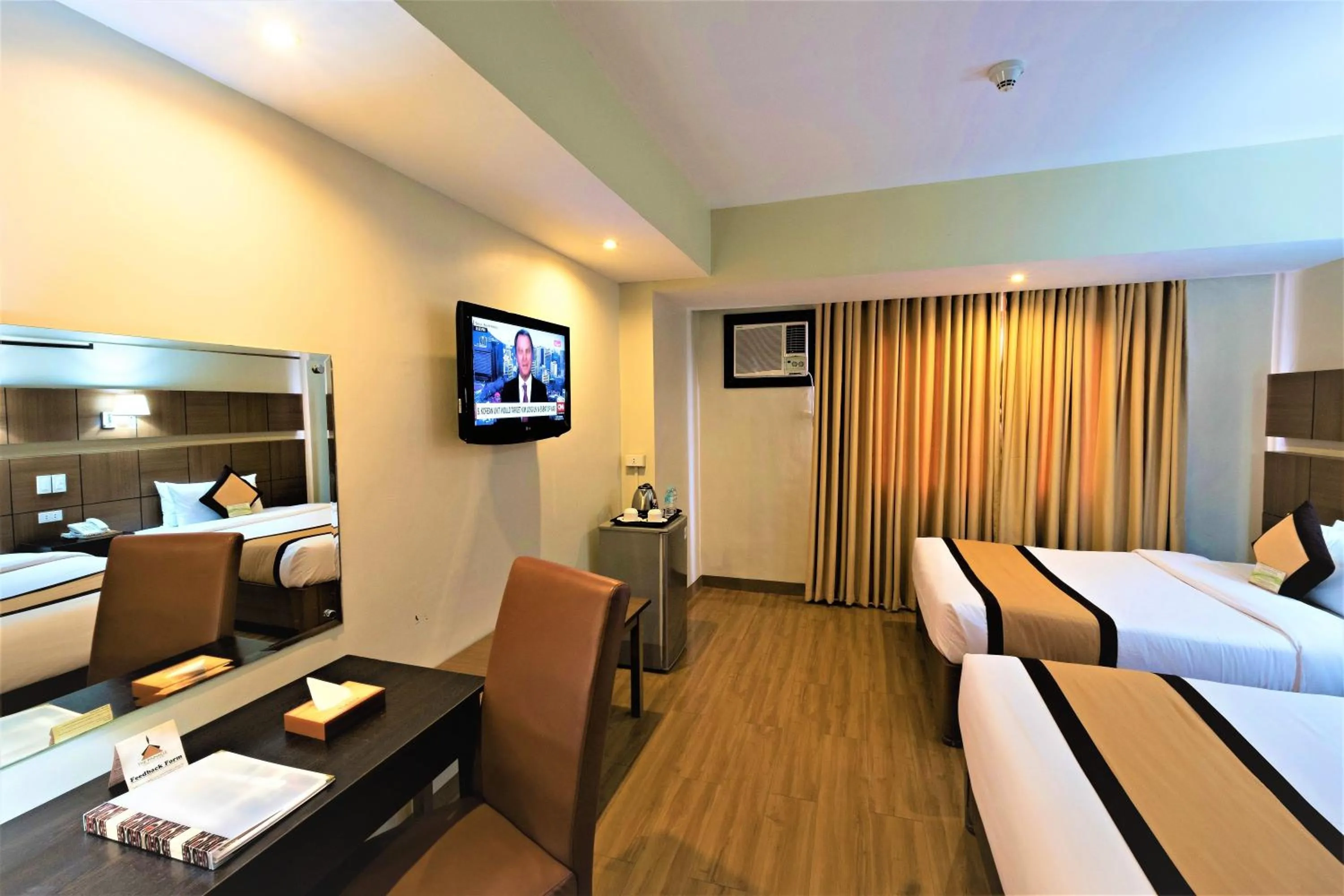 Bed in The Pinnacle Hotel and Suites