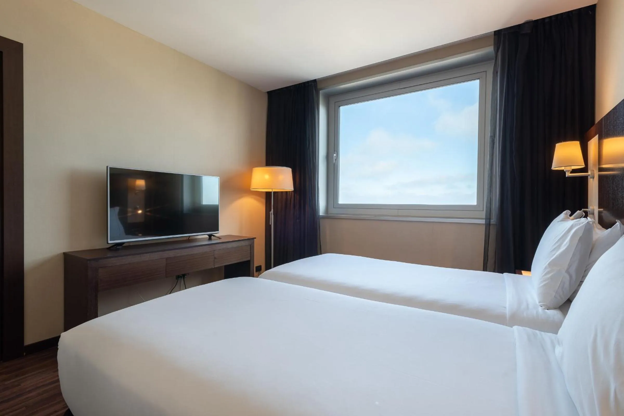 Bed in Leonardo Royal Hotel Barcelona Forum