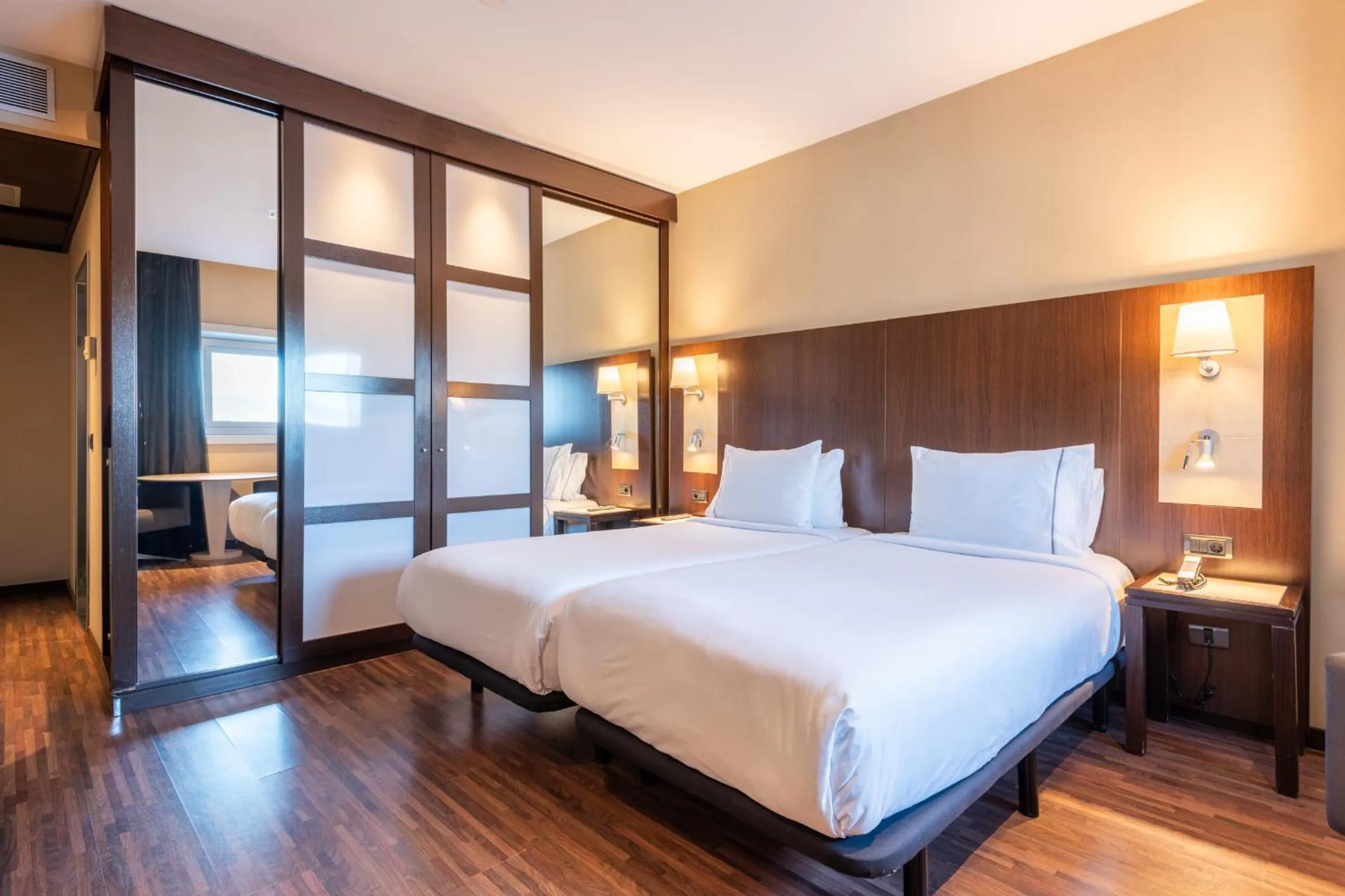 Bed in Leonardo Royal Hotel Barcelona Forum