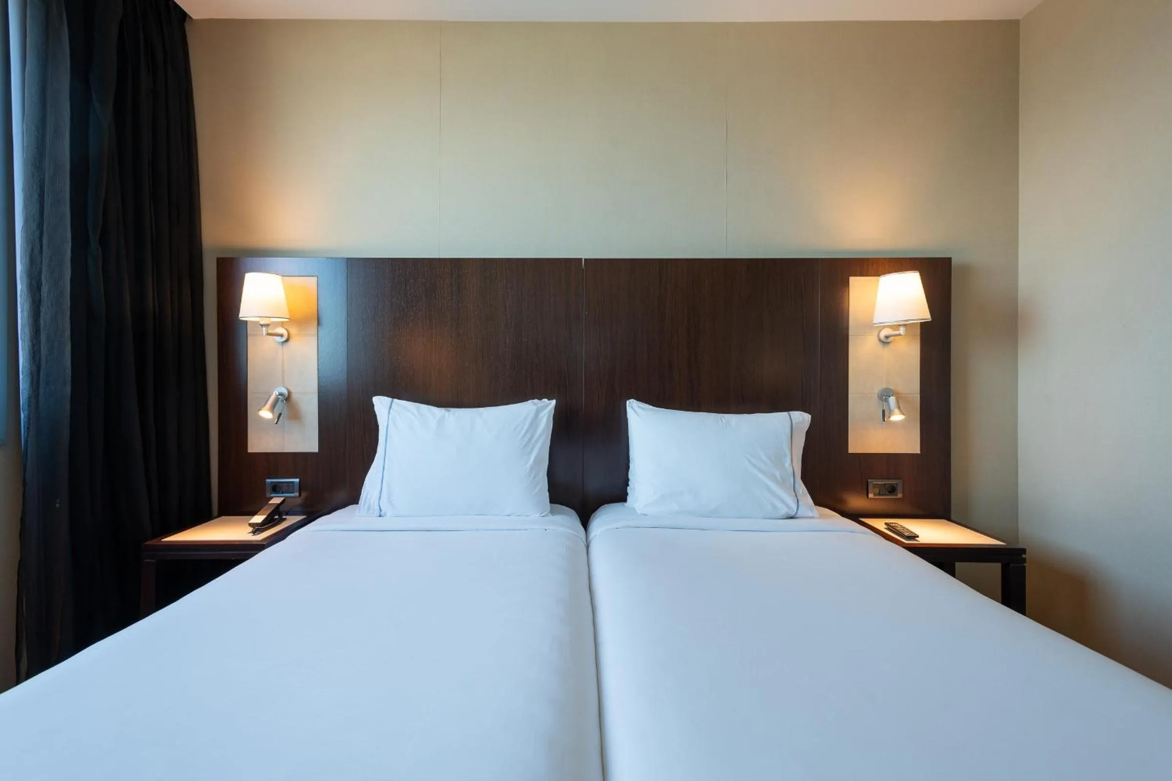 Bed in Leonardo Royal Hotel Barcelona Forum