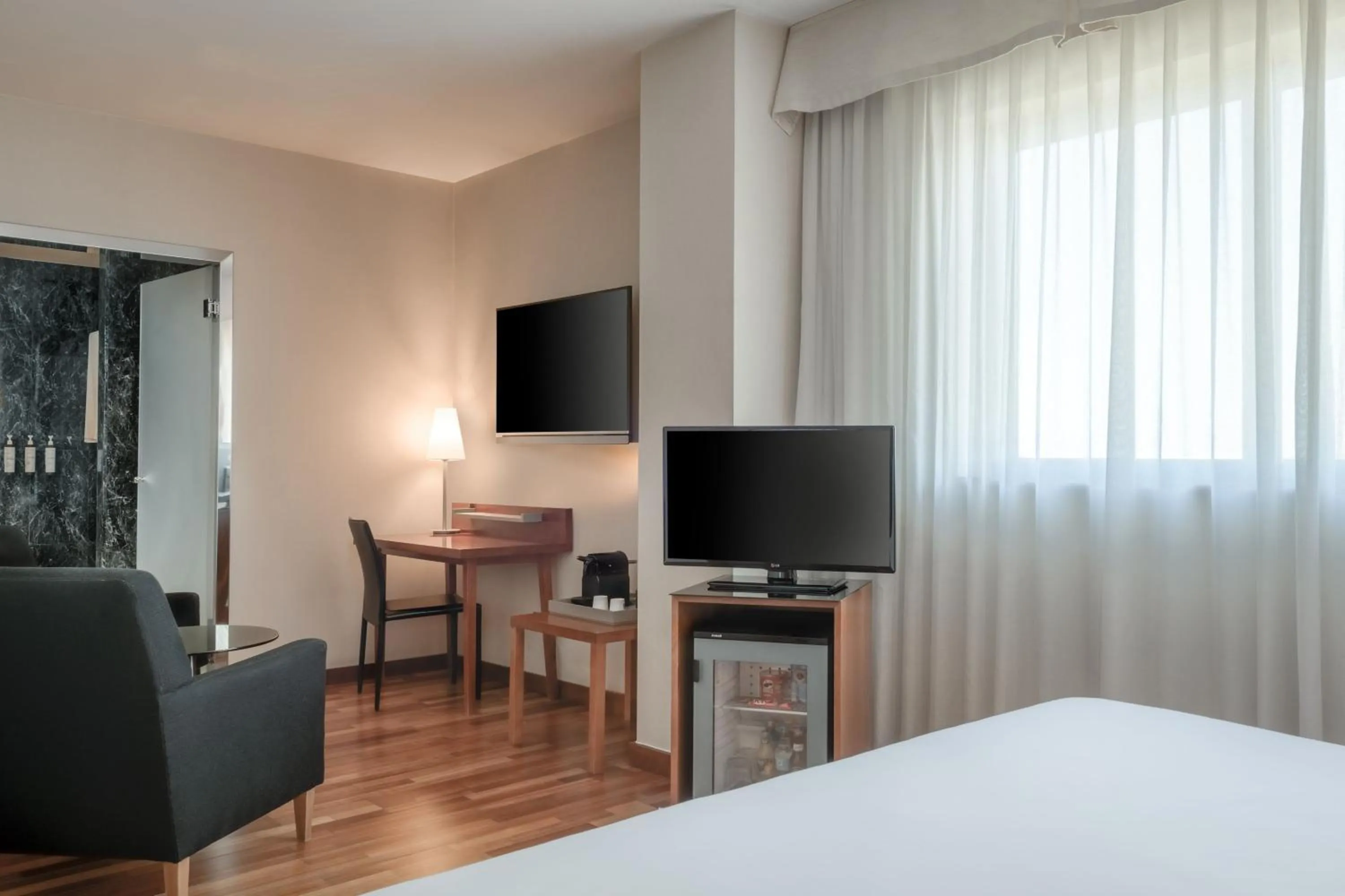 Photo of the whole room, Bed in AC Hotel Alcalá de Henares by Marriott