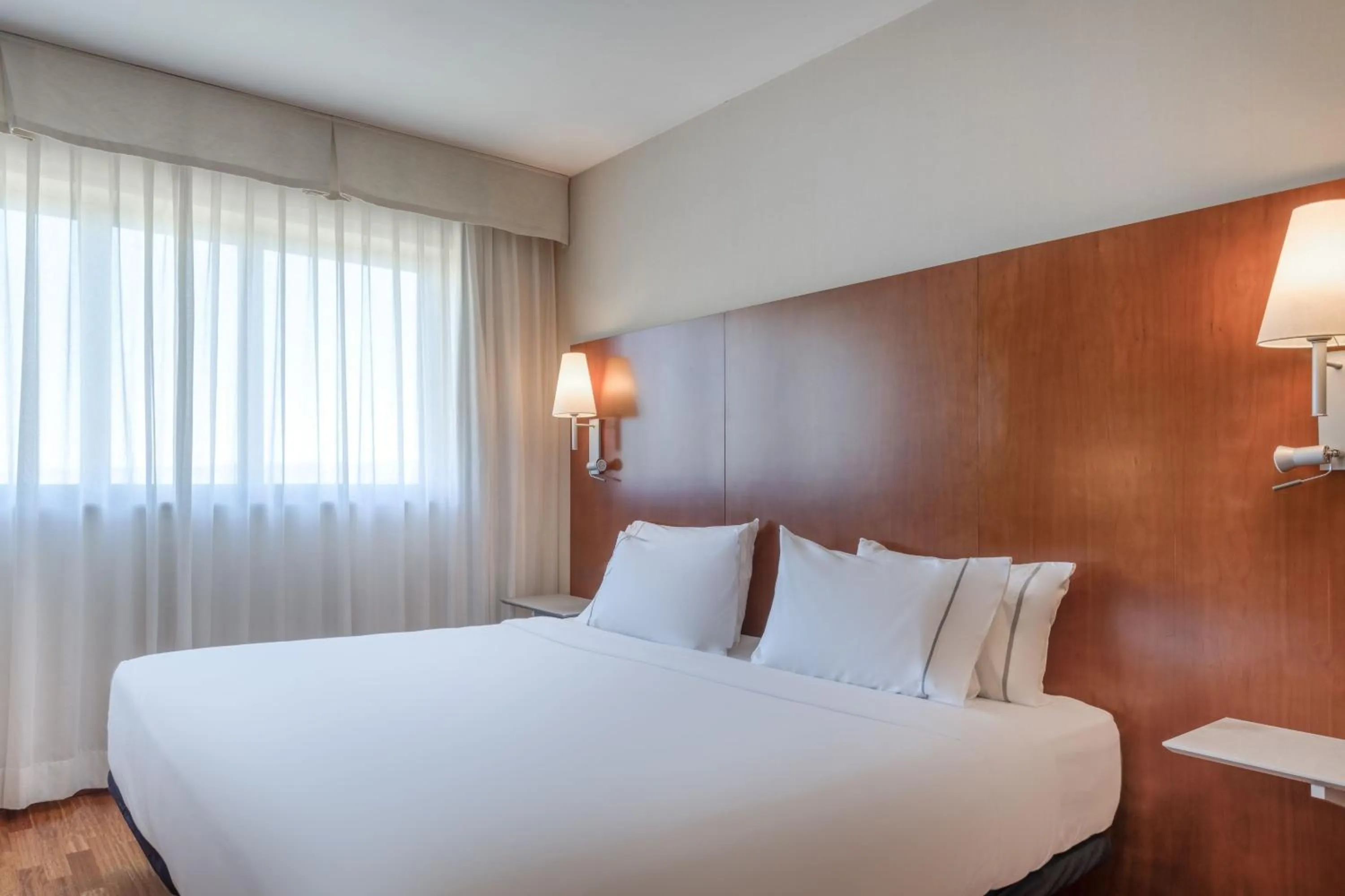 Photo of the whole room, Bed in AC Hotel Alcalá de Henares by Marriott