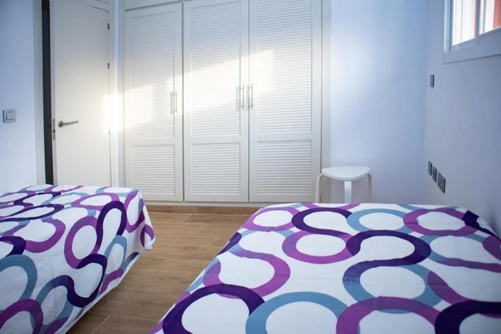 Bedroom, Bed in Apartamento "Casa el Sargazo" en Vera Playa con Piscina, Solarium, Wifi y Parking Gratis