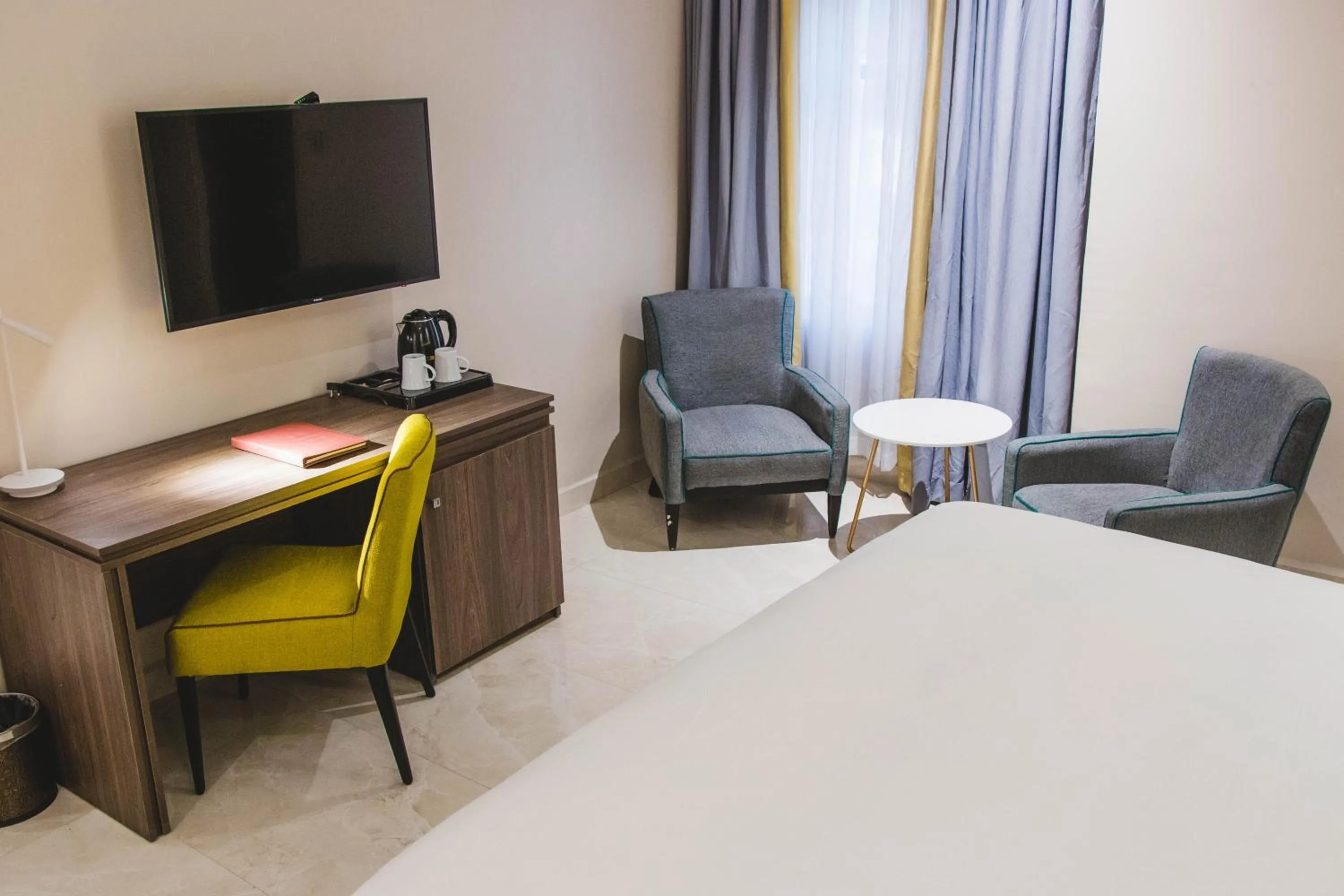 Bed in AMBER CITY HOTELS