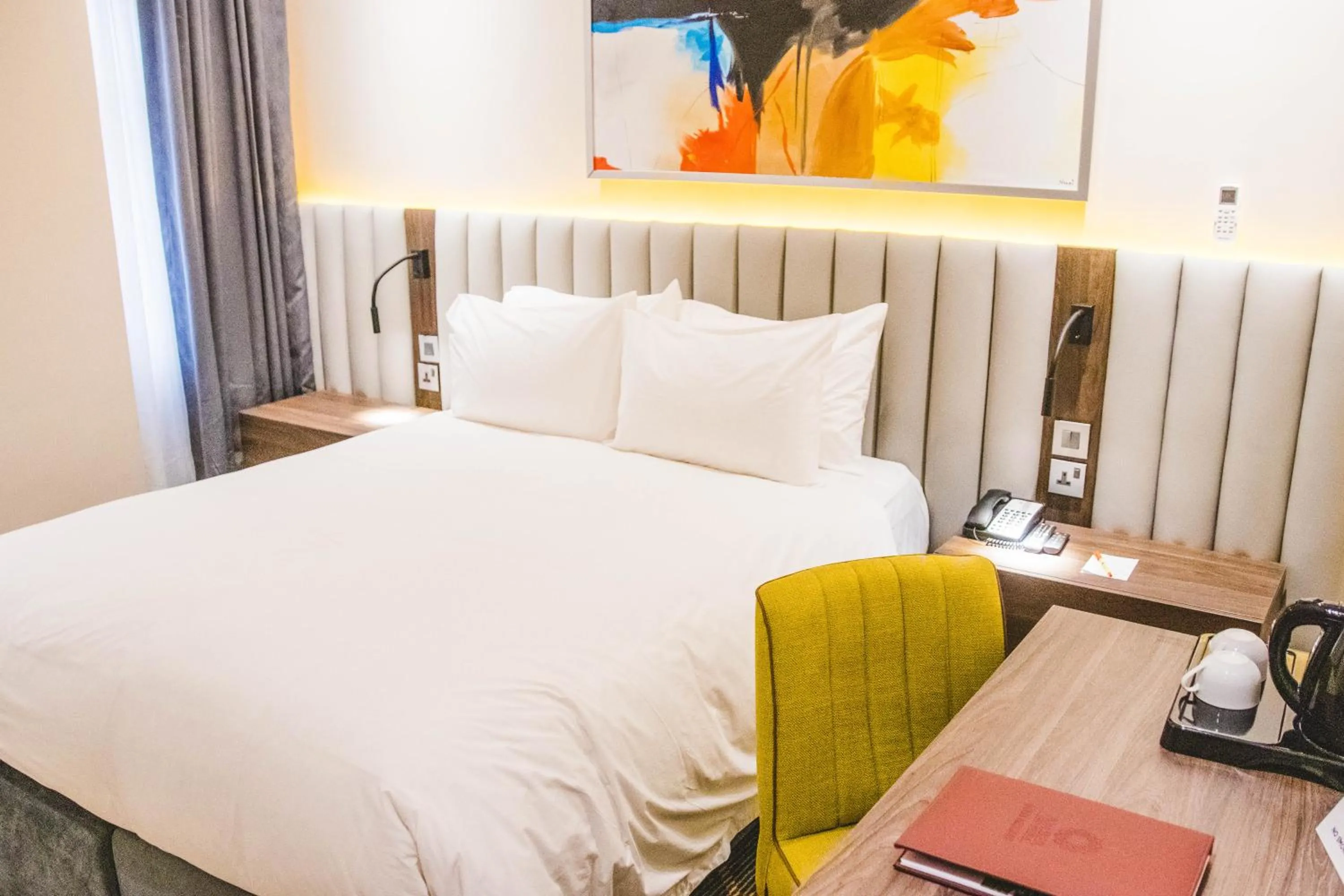 Bed in AMBER CITY HOTELS