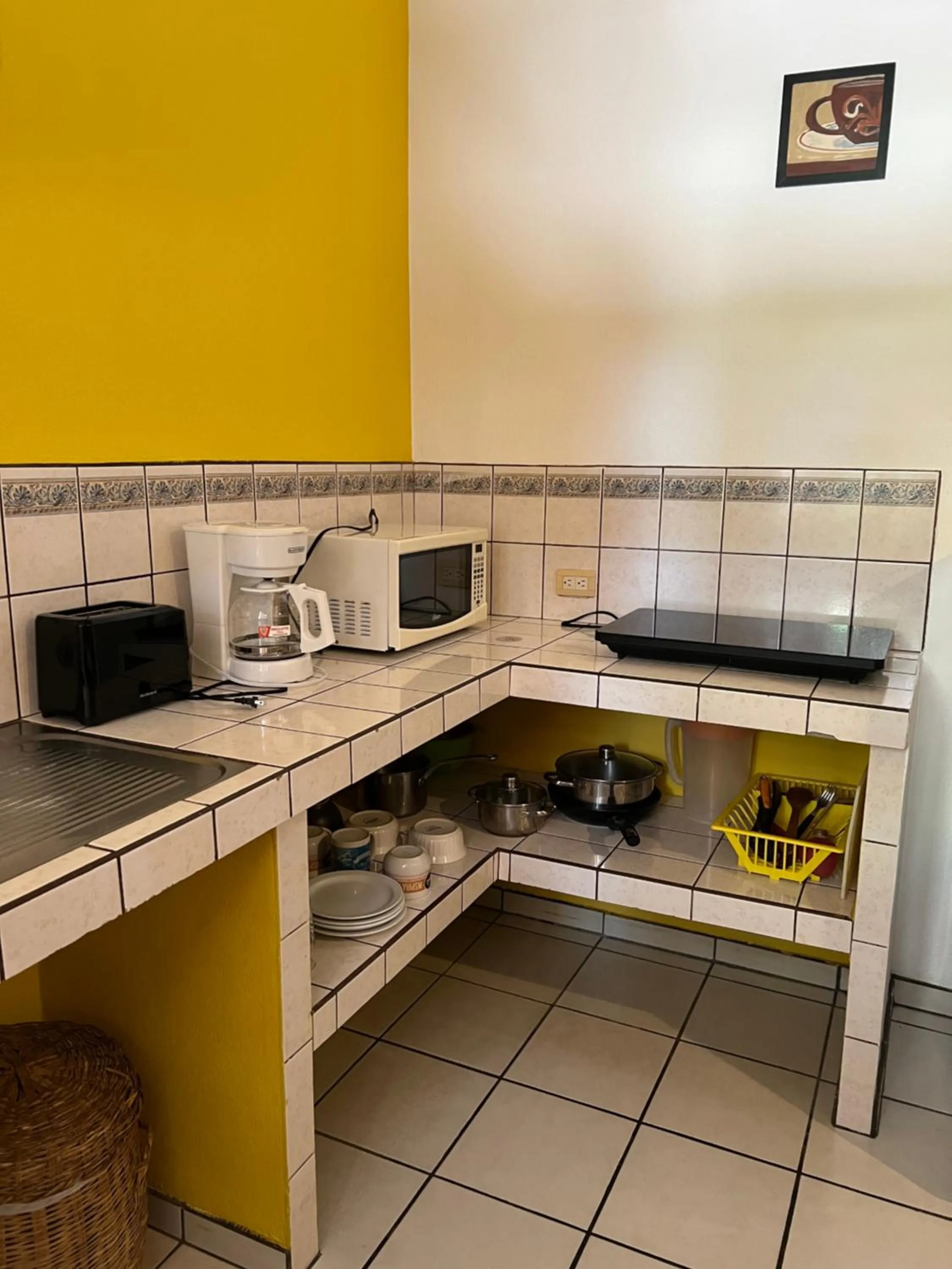 stove in Cabinas El Colibri, Apart Hotel