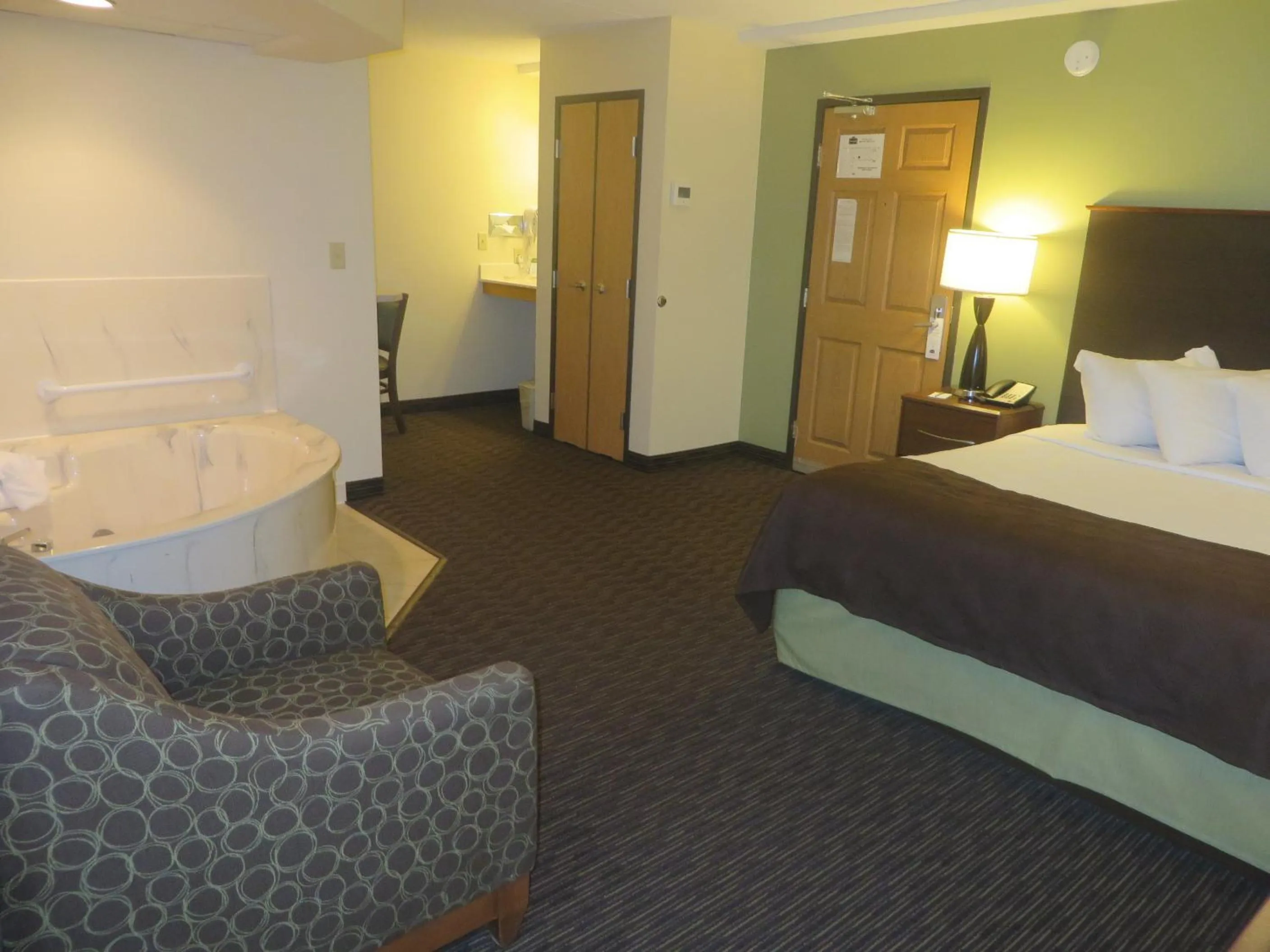 Bed in AmericInn by Wyndham Rice Lake