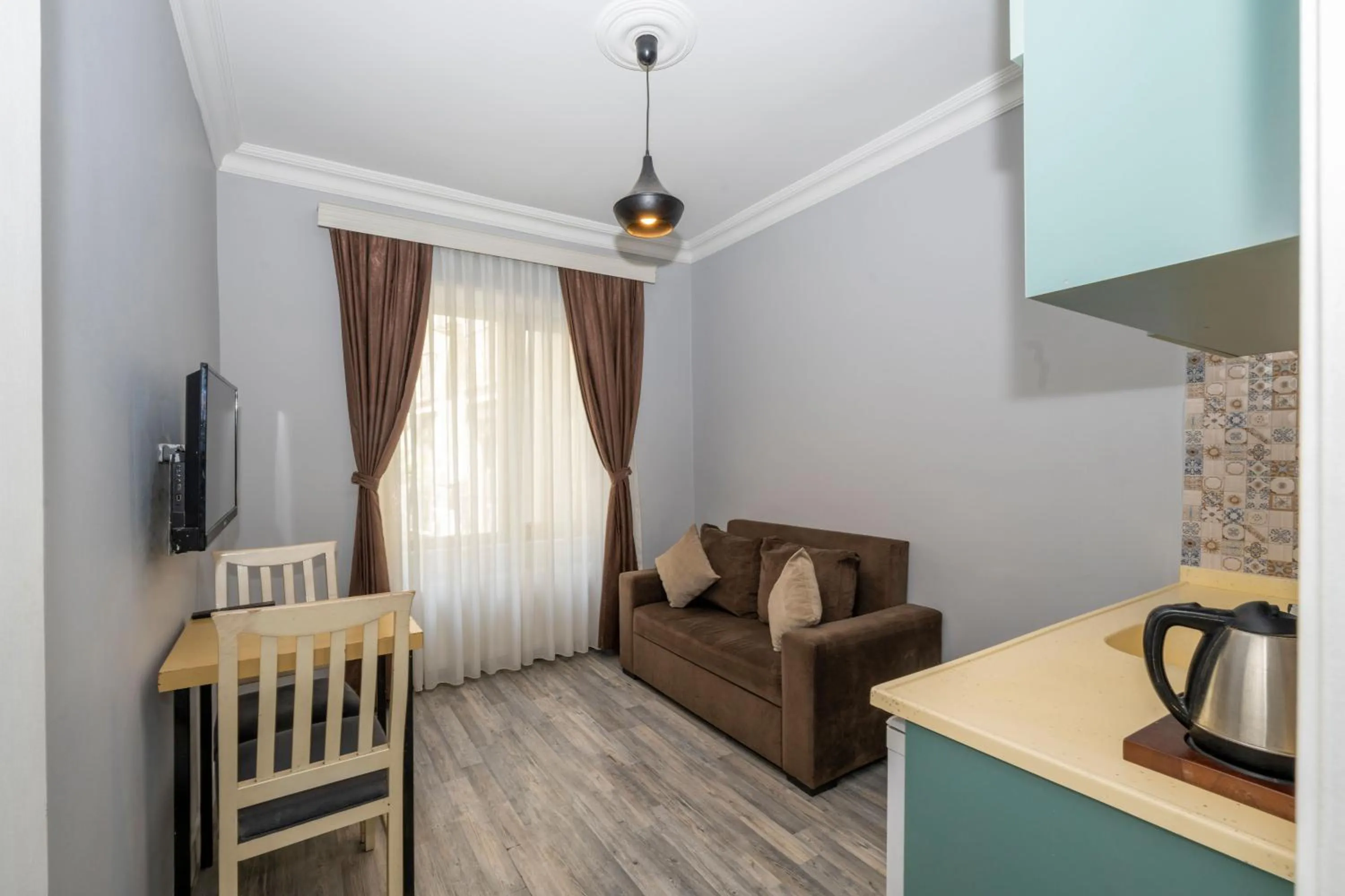 Kitchen or kitchenette in Cirrus Suites