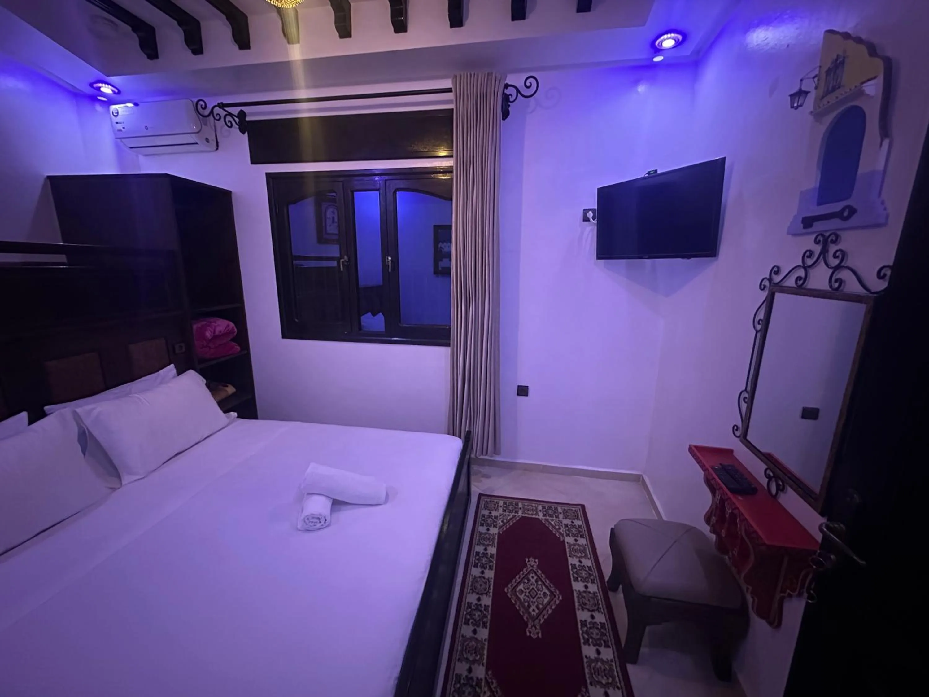 Bed in Maison d'hôtes Afassi