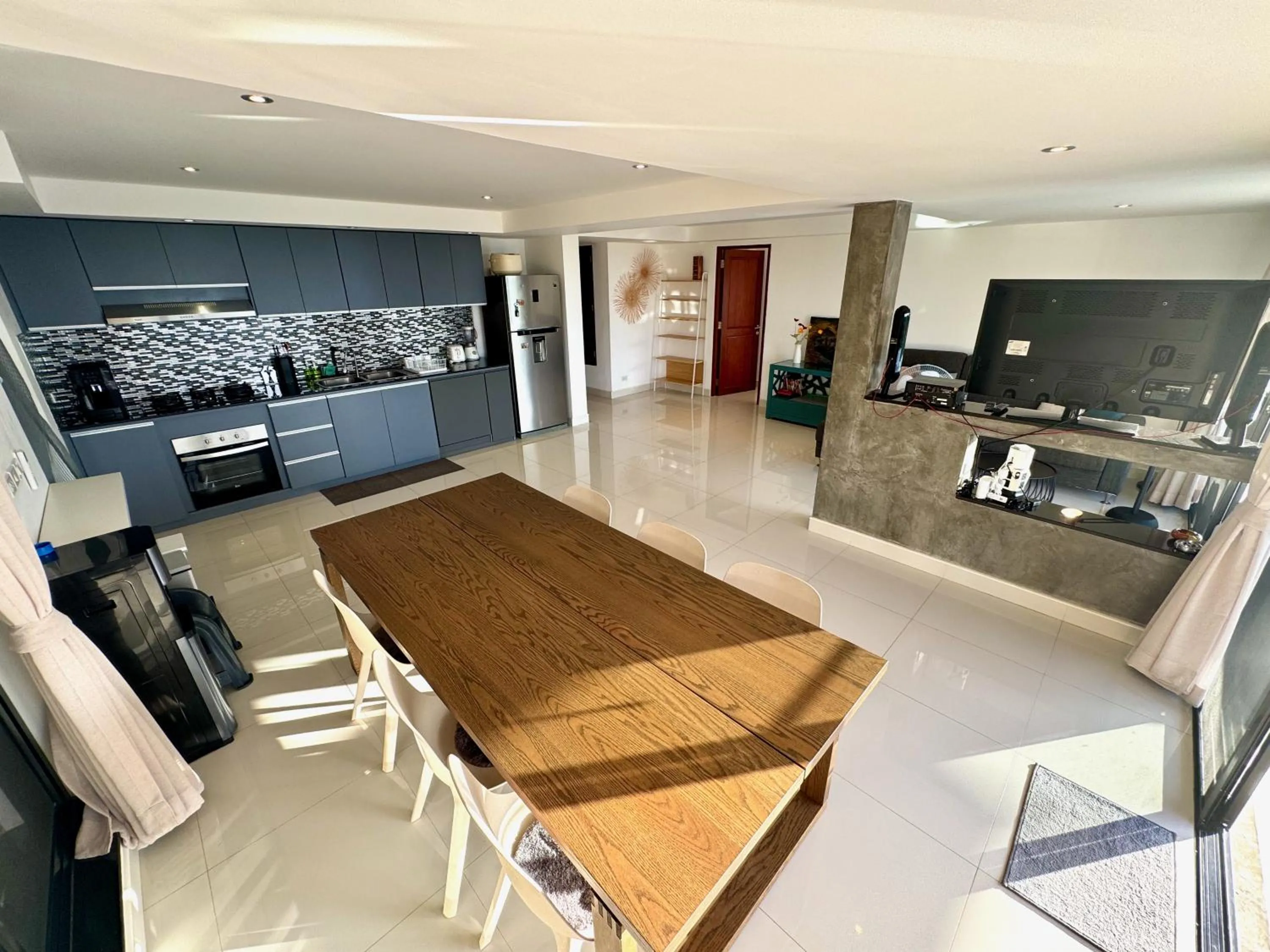TV and multimedia in The Carma - stylish and luxury sea view pool villa