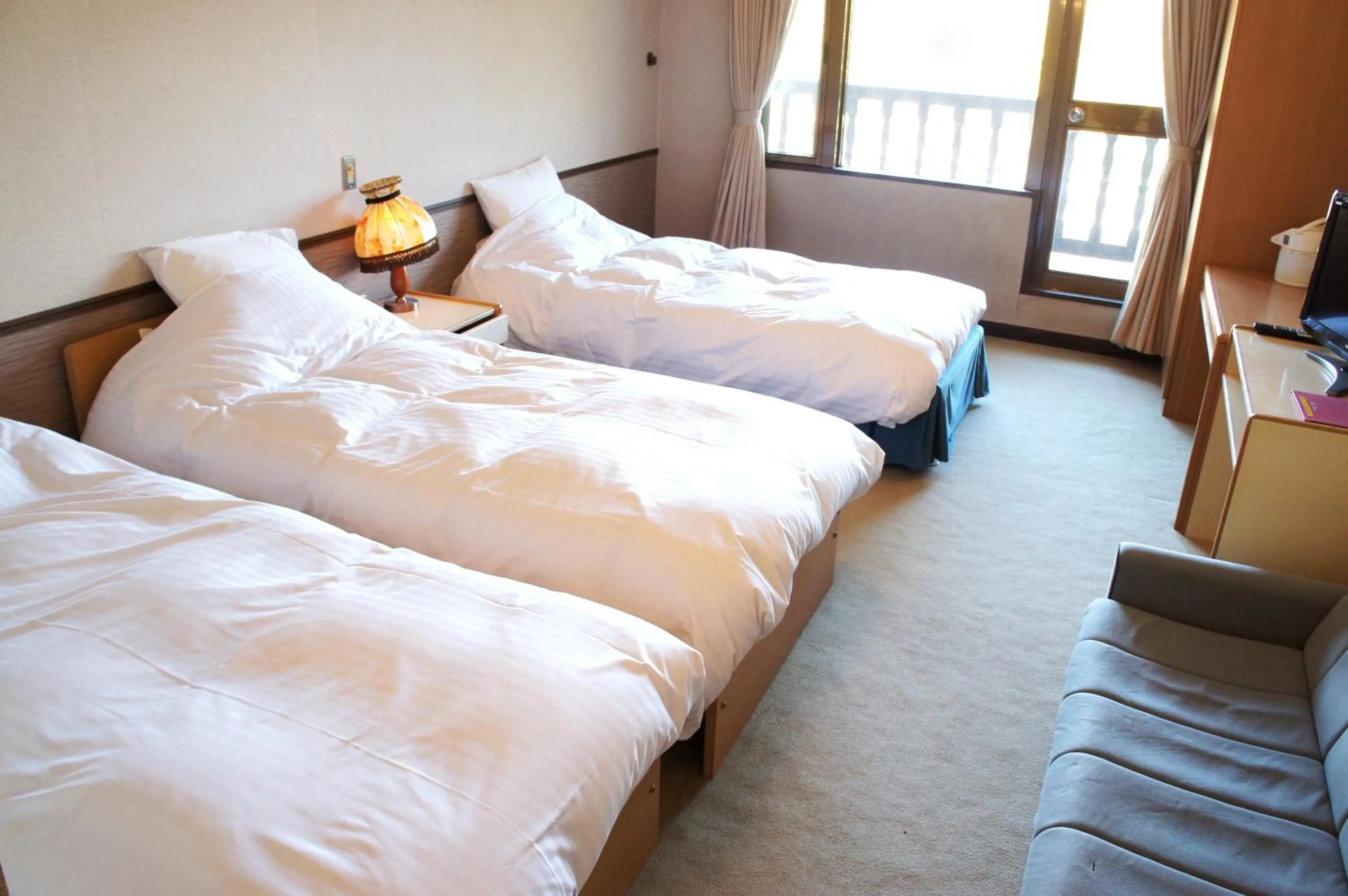 Bed in Petit Hotel Shitaka