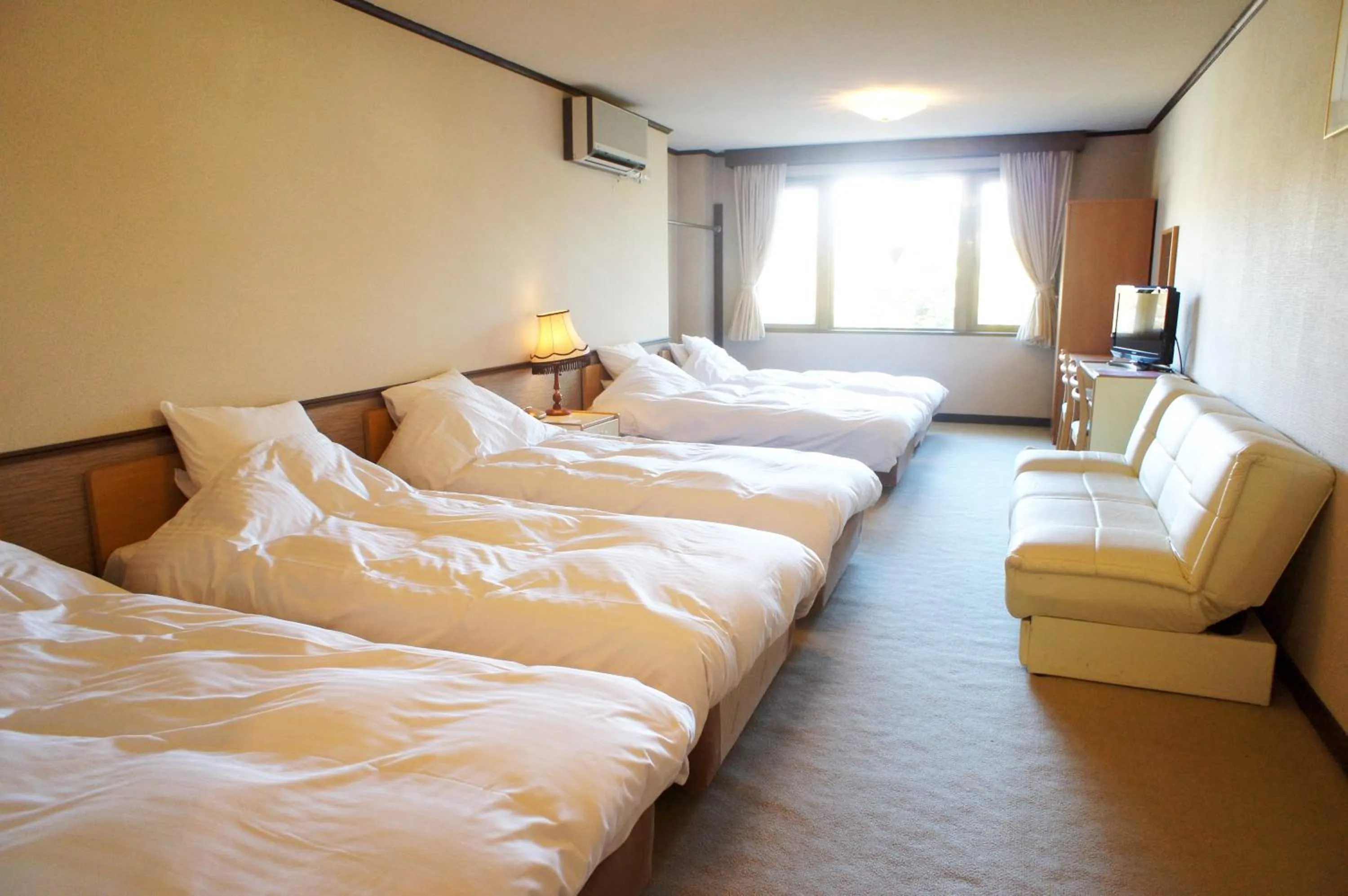 Bed in Petit Hotel Shitaka