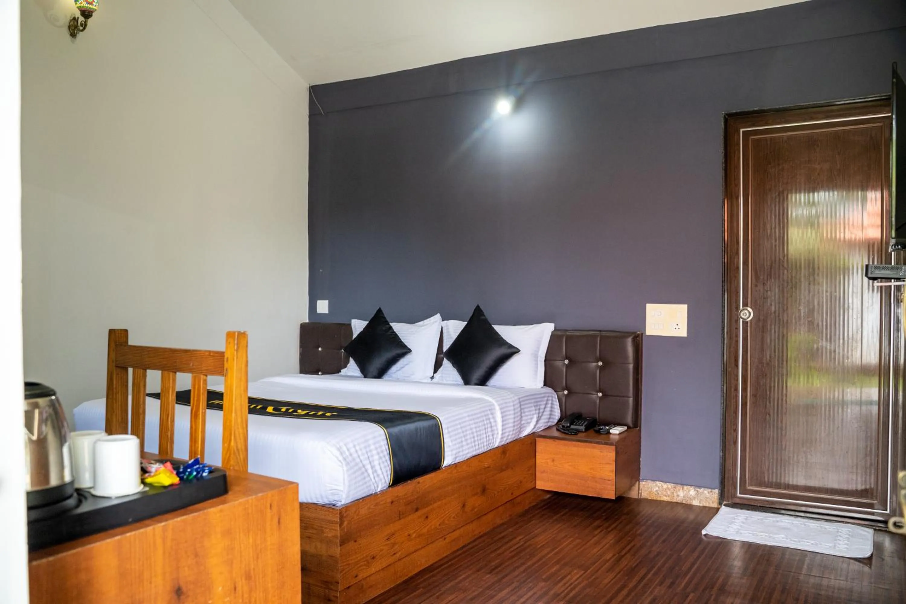 Bed in DhanRains Moonlight Retreat Cottages