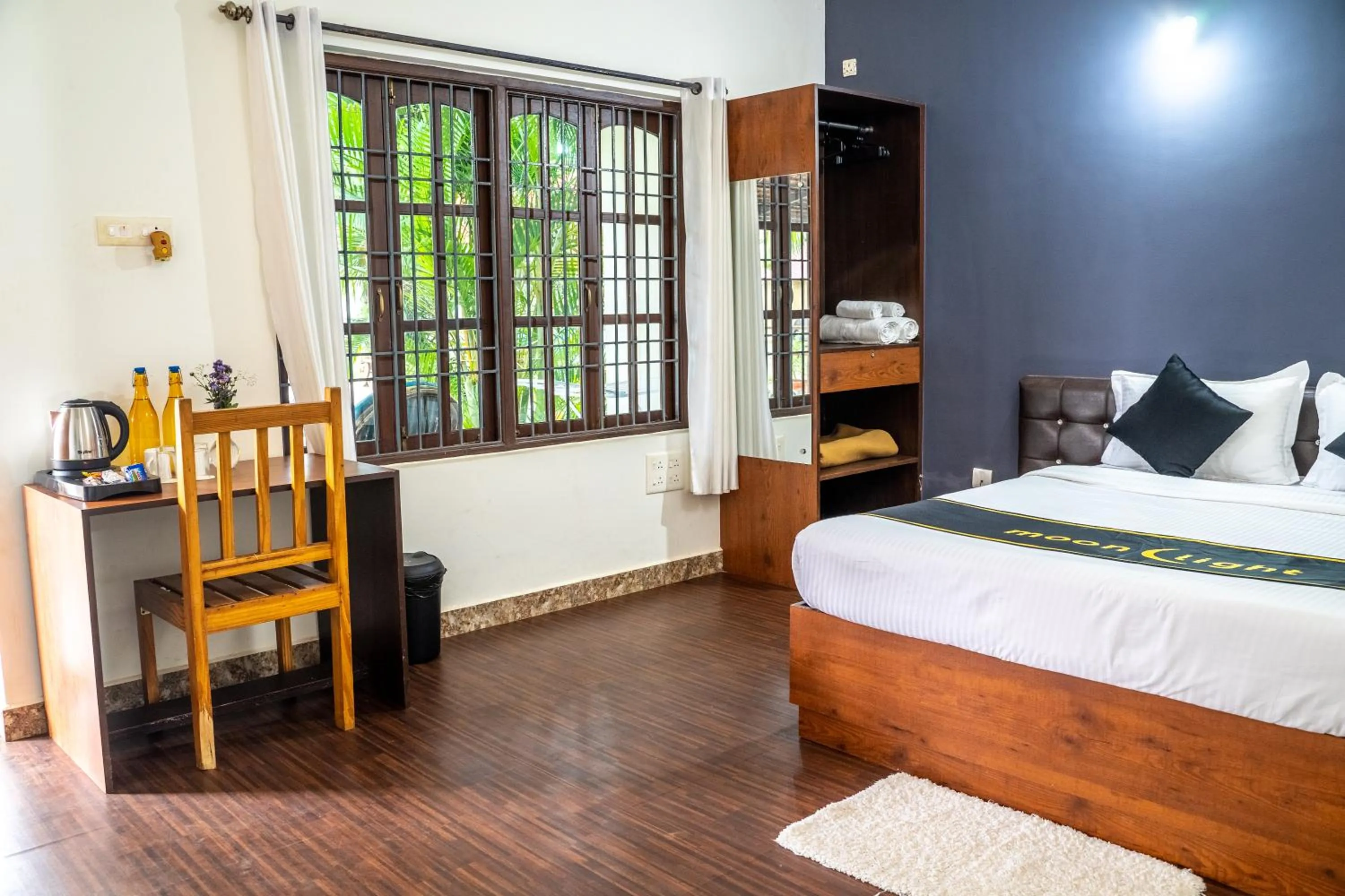 Bed in DhanRains Moonlight Retreat Cottages