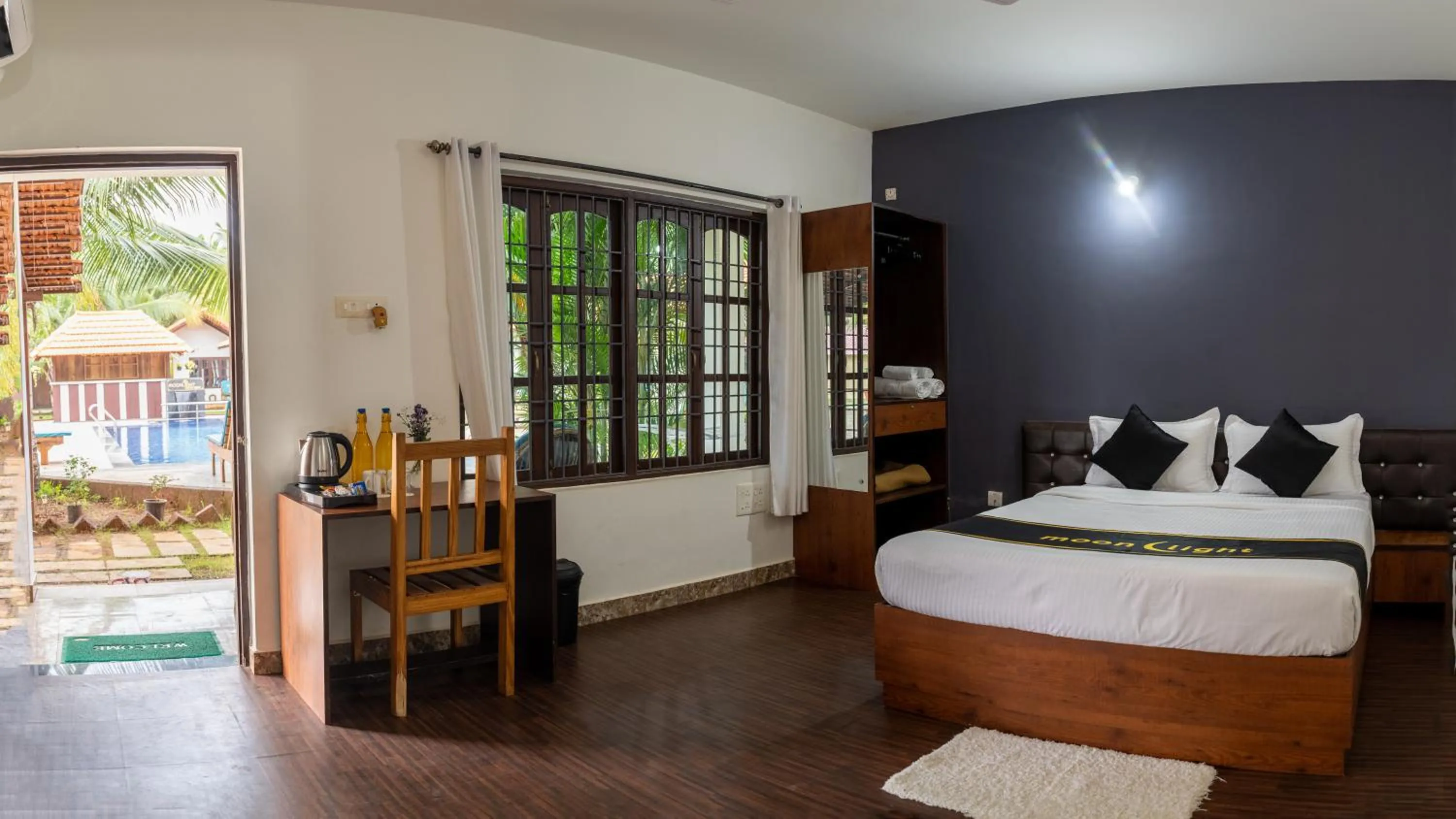 Bed in DhanRains Moonlight Retreat Cottages