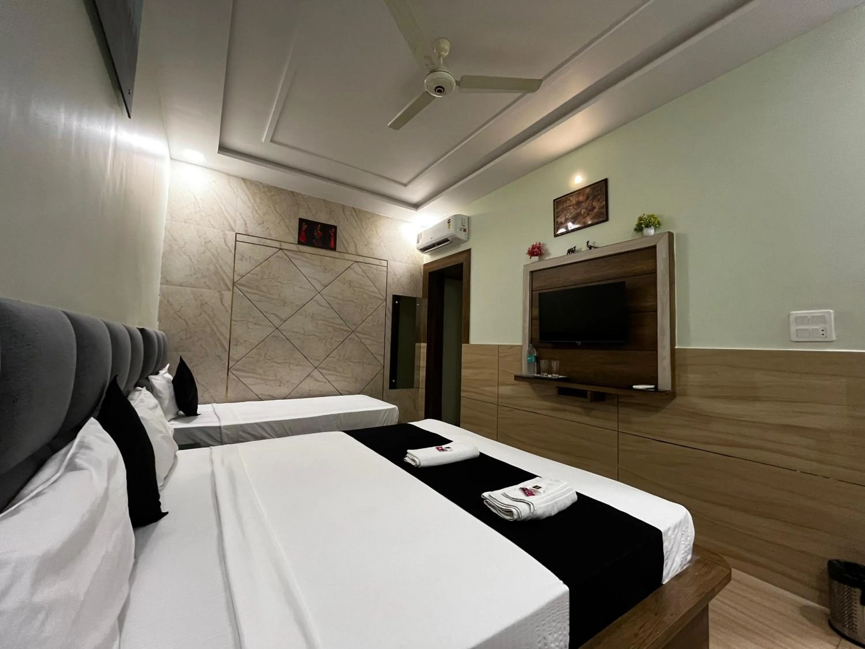 Bed in Taj Nice Point Manage by Taj Sunrise Group