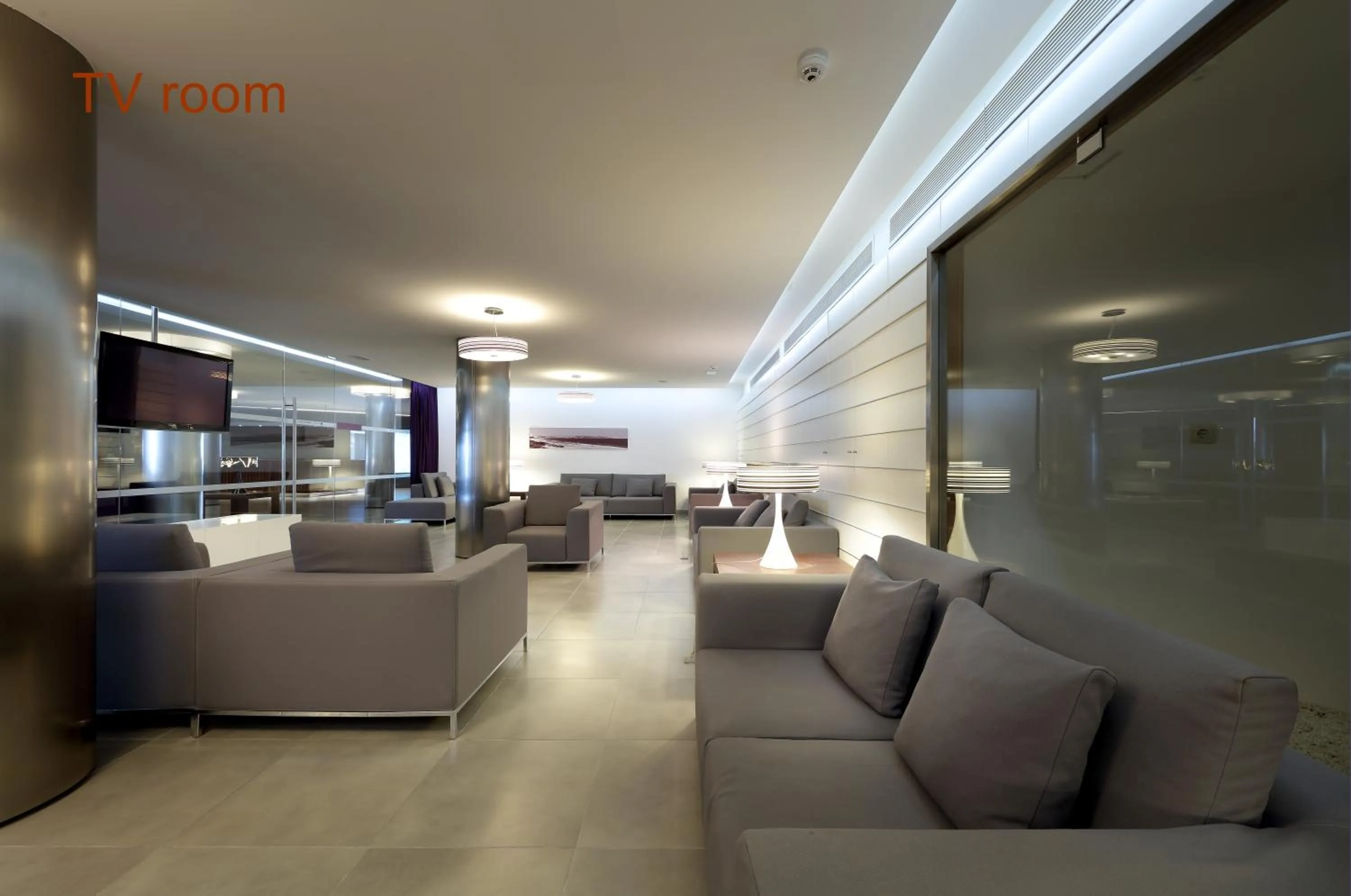 Communal lounge/ TV room in Hotel Garbi Ibiza & Spa