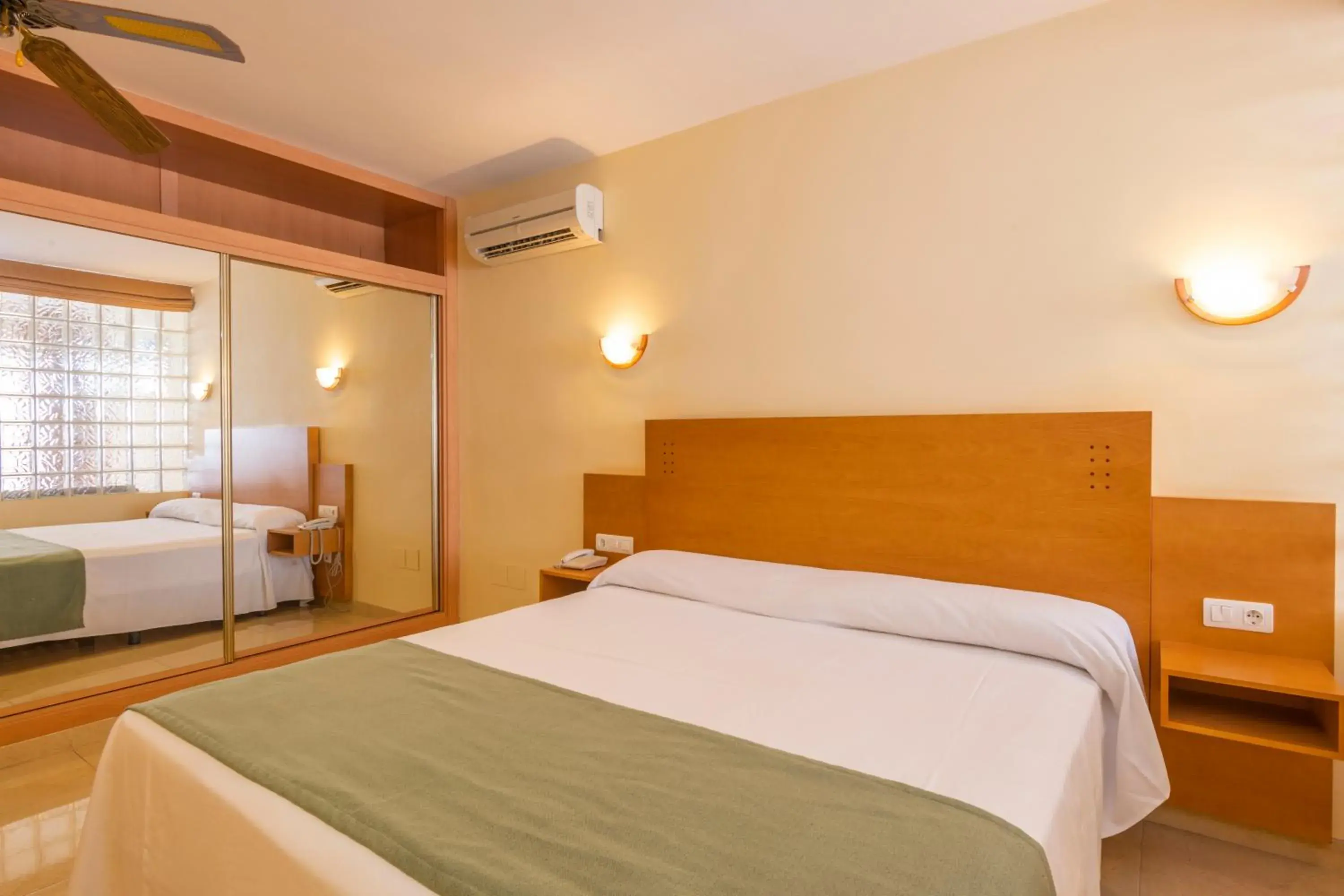 Bed in Hotel Parasol by Dorobe Bed in Hotel Parasol by Dorobe