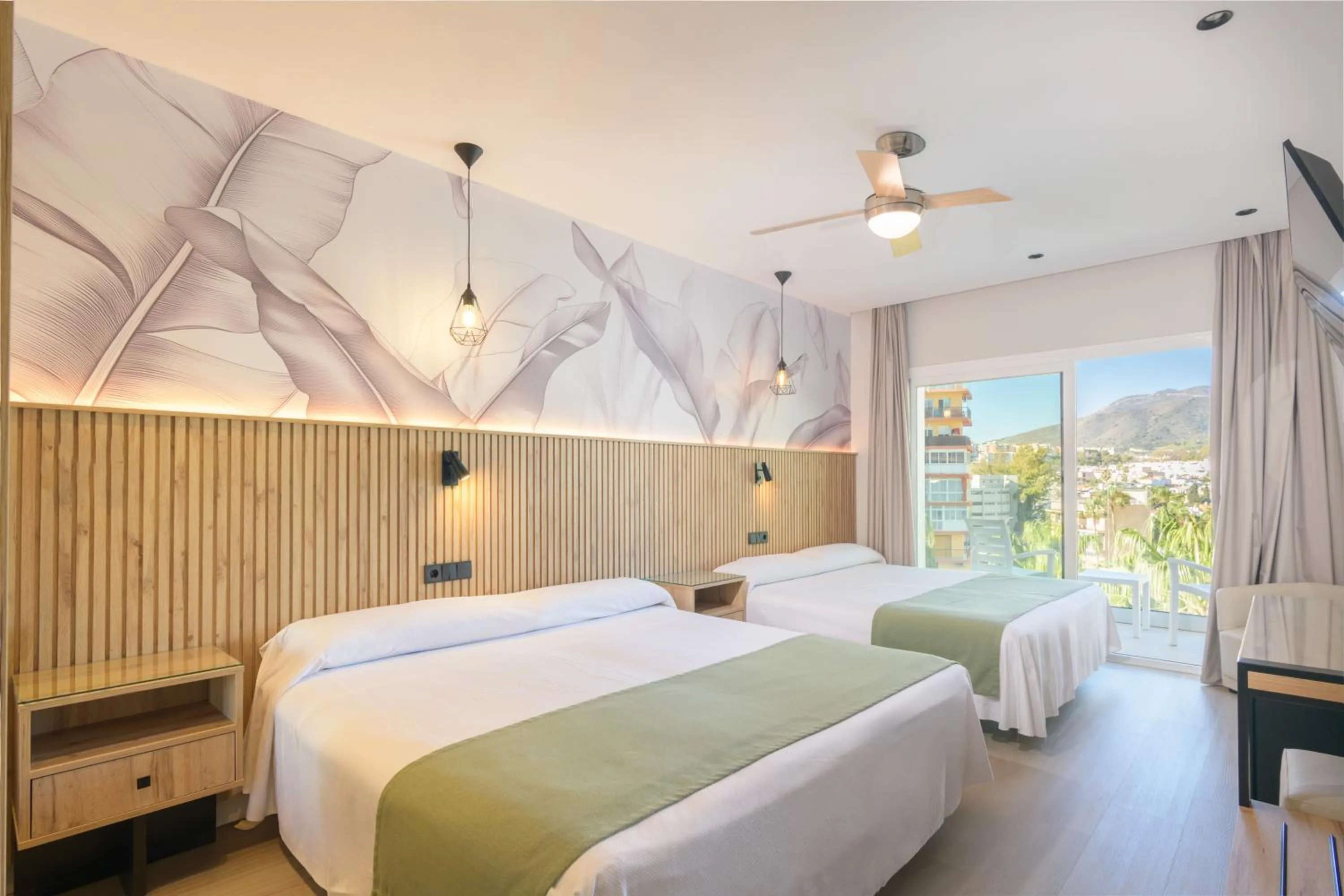 Bed in Hotel Parasol by Dorobe