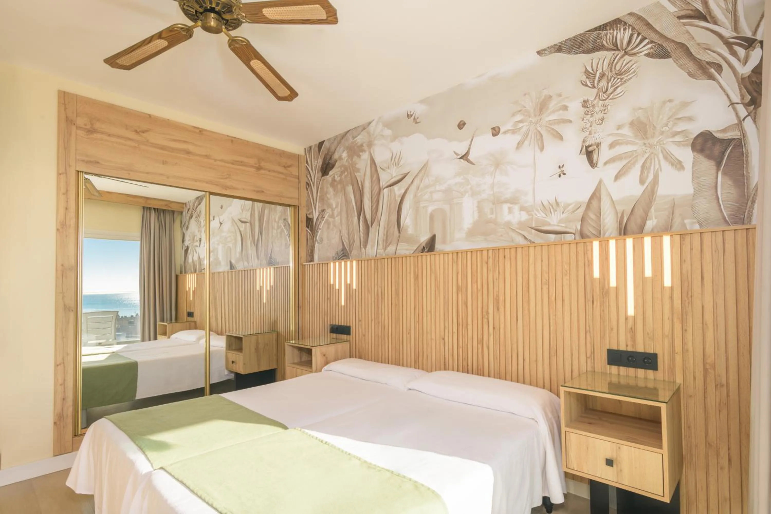 Bed in Hotel Parasol by Dorobe