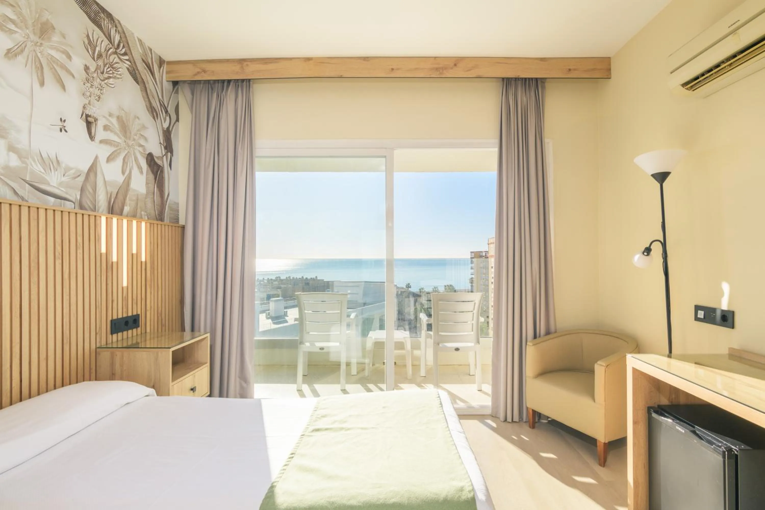 Bed in Hotel Parasol by Dorobe