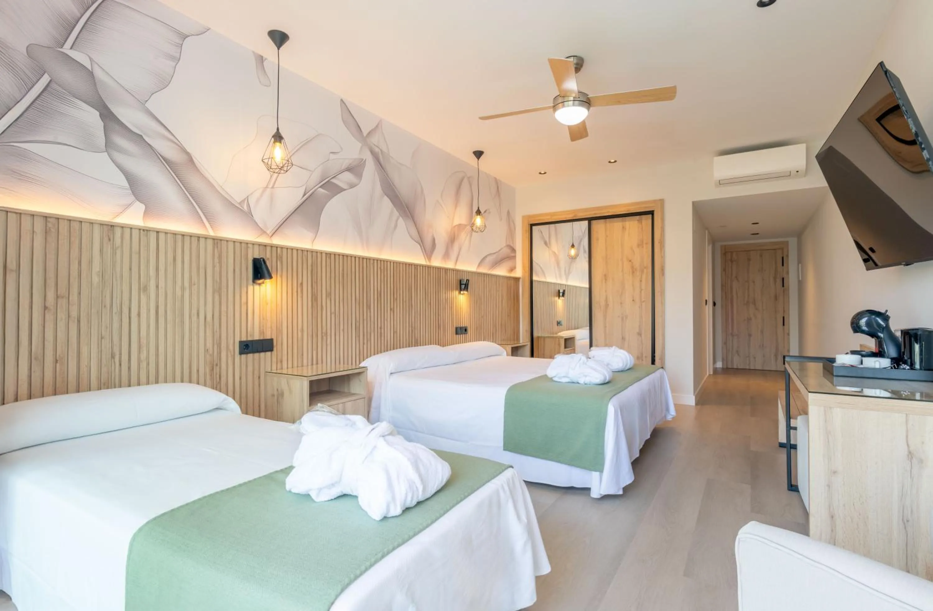 Bed in Hotel Parasol by Dorobe