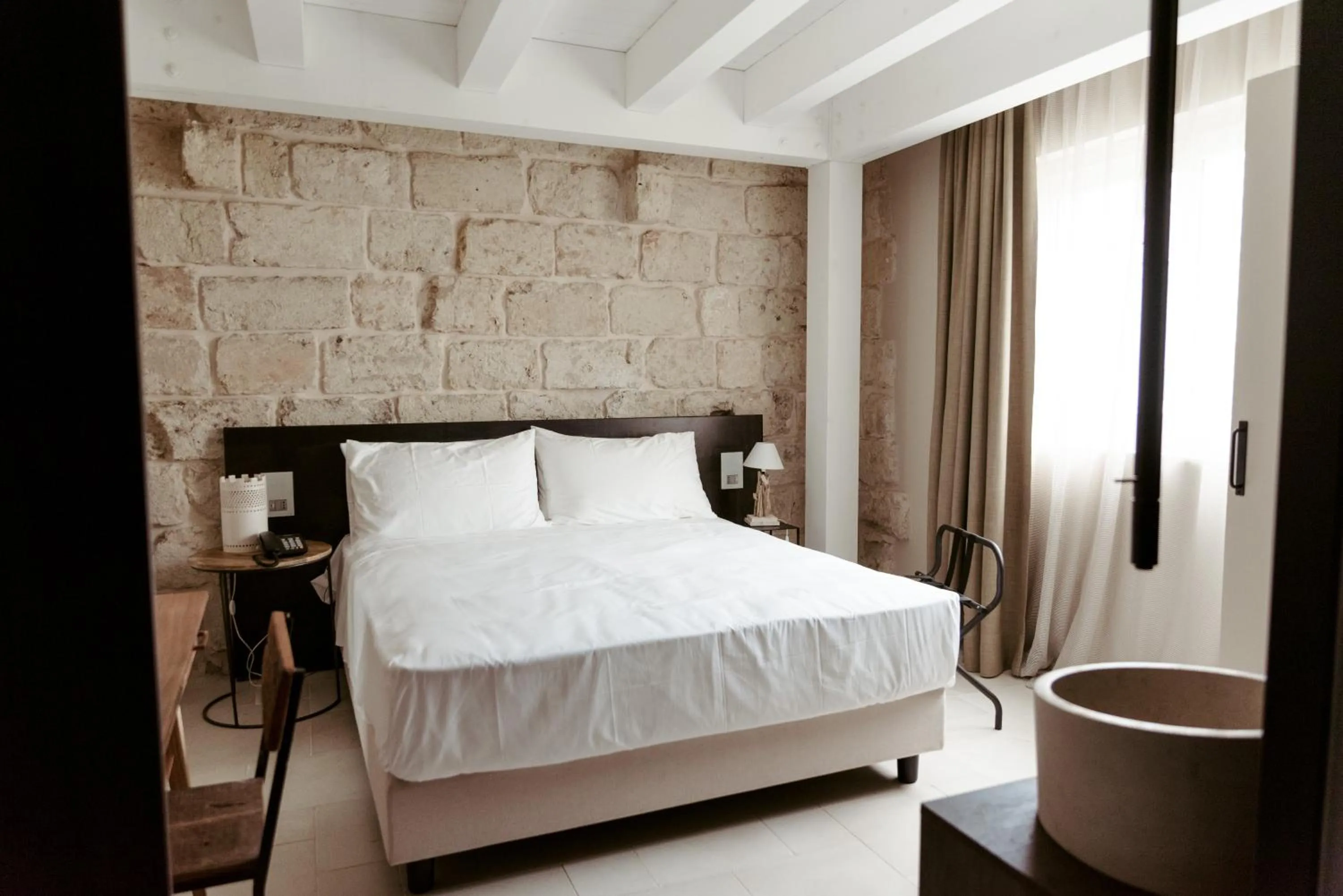 Bed in Le Carasse Boutique Hotel