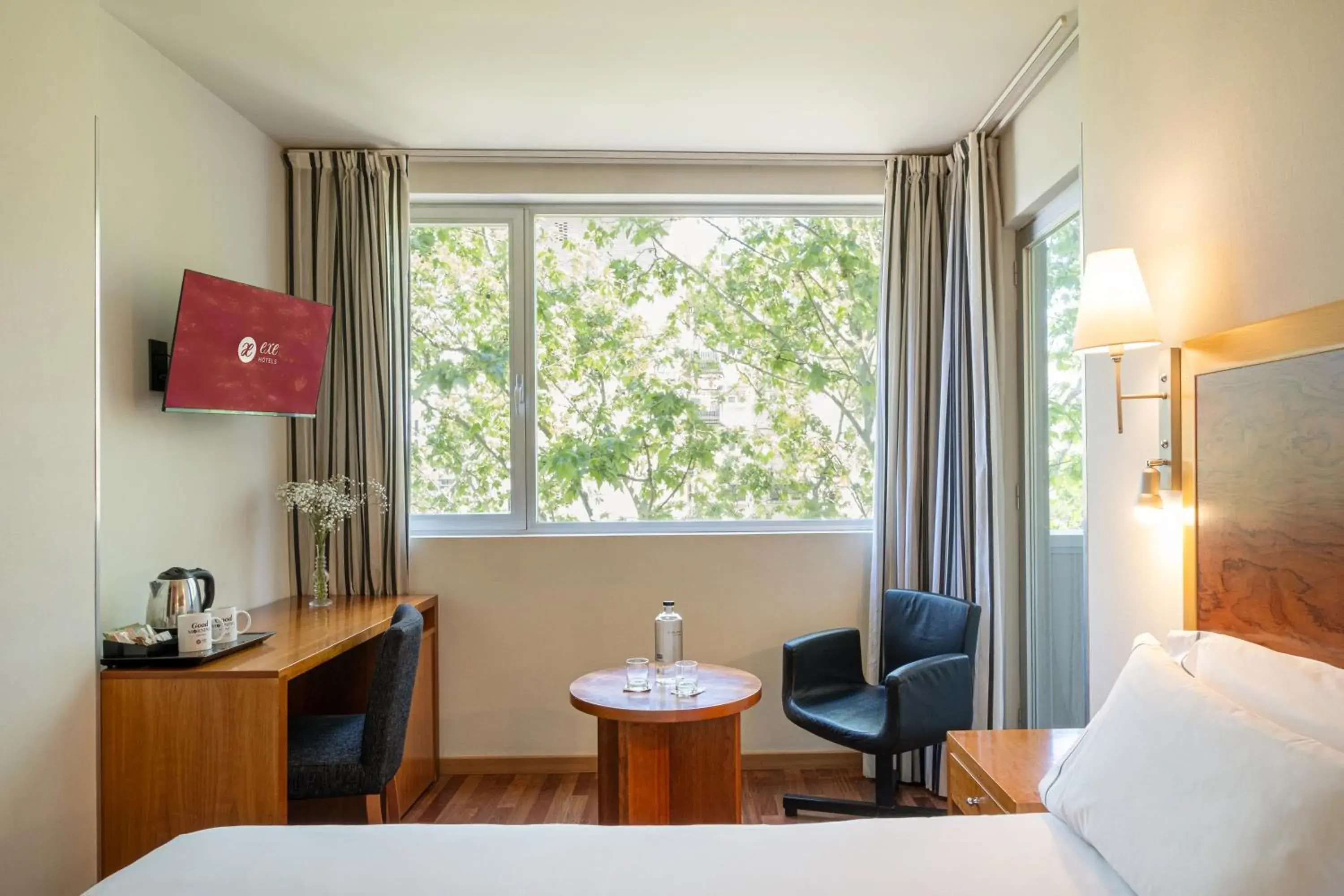 Photo of the whole room, Bed in Exe Plaza Delicias Photo of the whole room, Bed in Exe Plaza Delicias