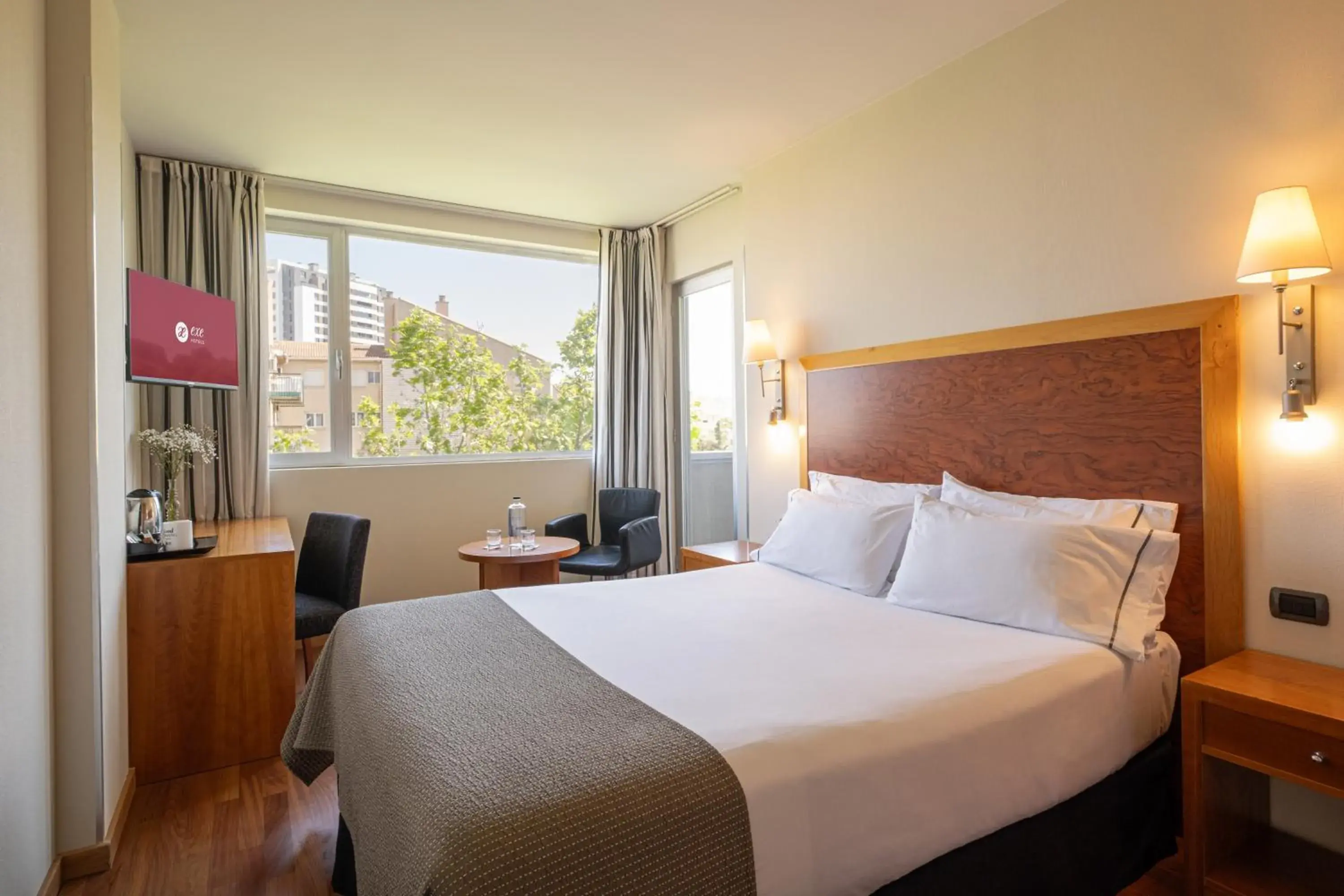 Photo of the whole room, Bed in Exe Plaza Delicias Photo of the whole room, Bed in Exe Plaza Delicias