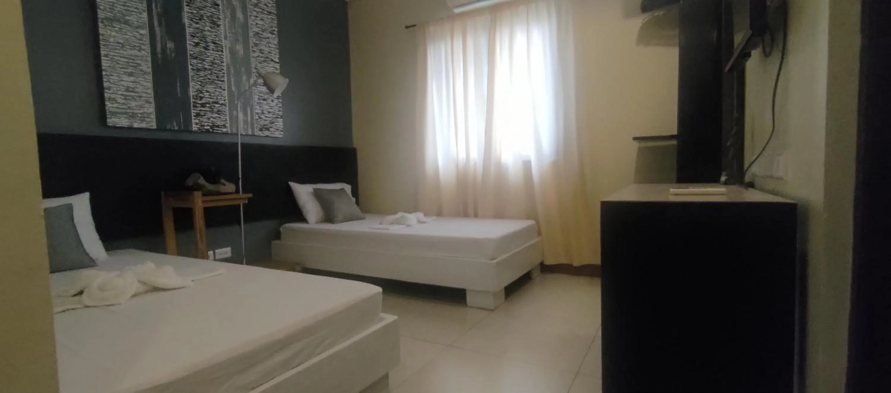 Photo of the whole room, Bed in Coron town travellers inn