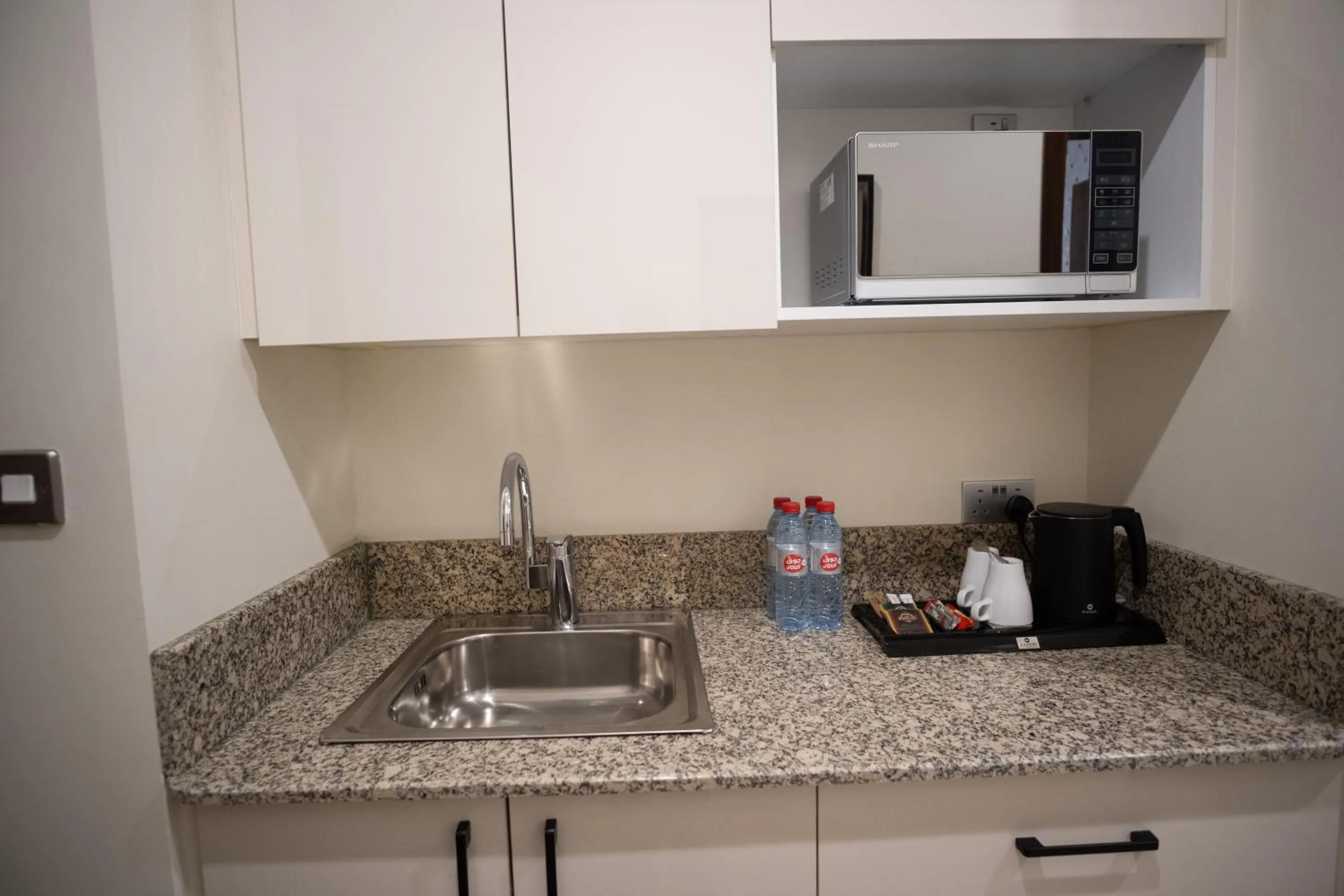 Kitchen or kitchenette in La Maison Hotel Doha