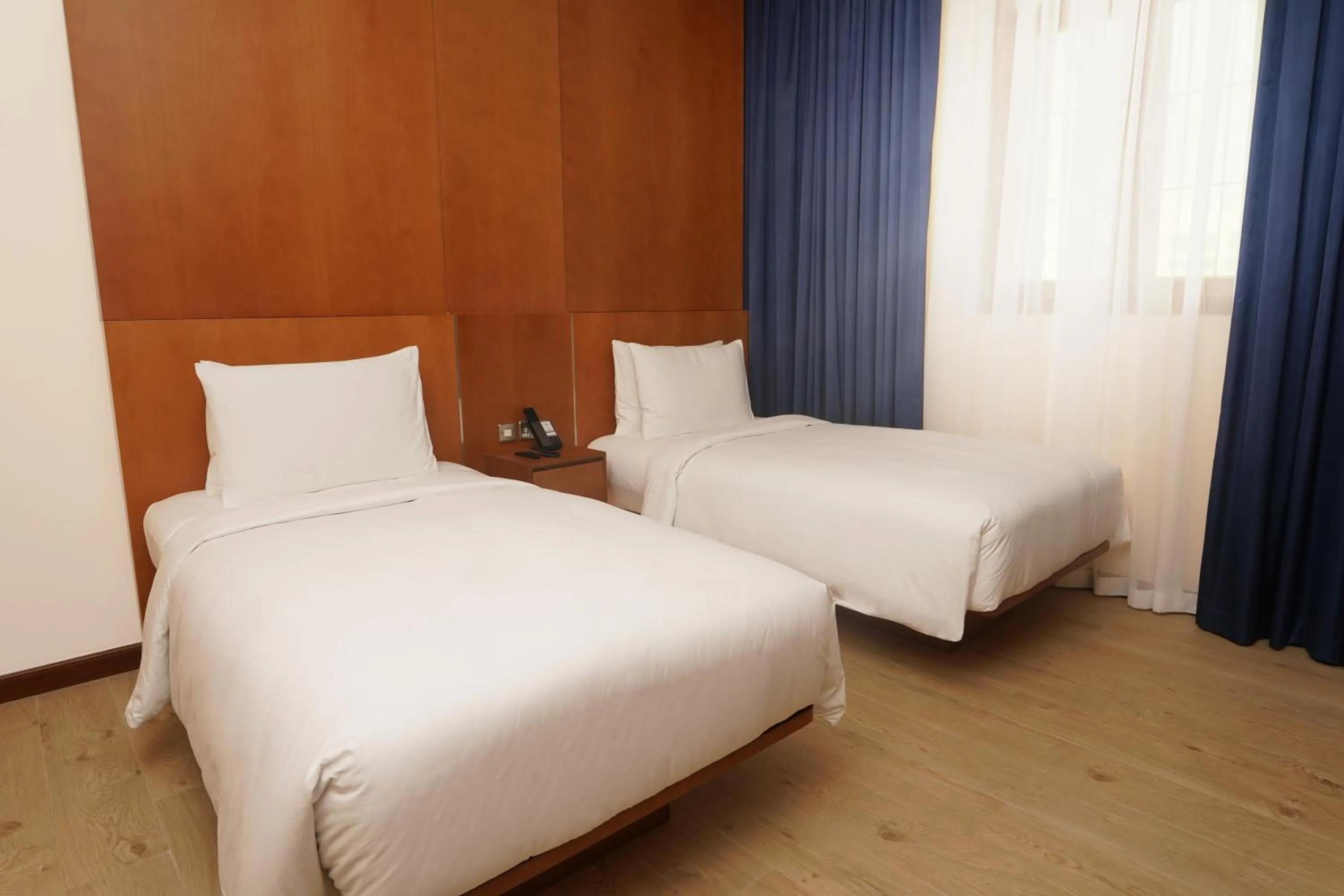 Bed in La Maison Hotel Doha