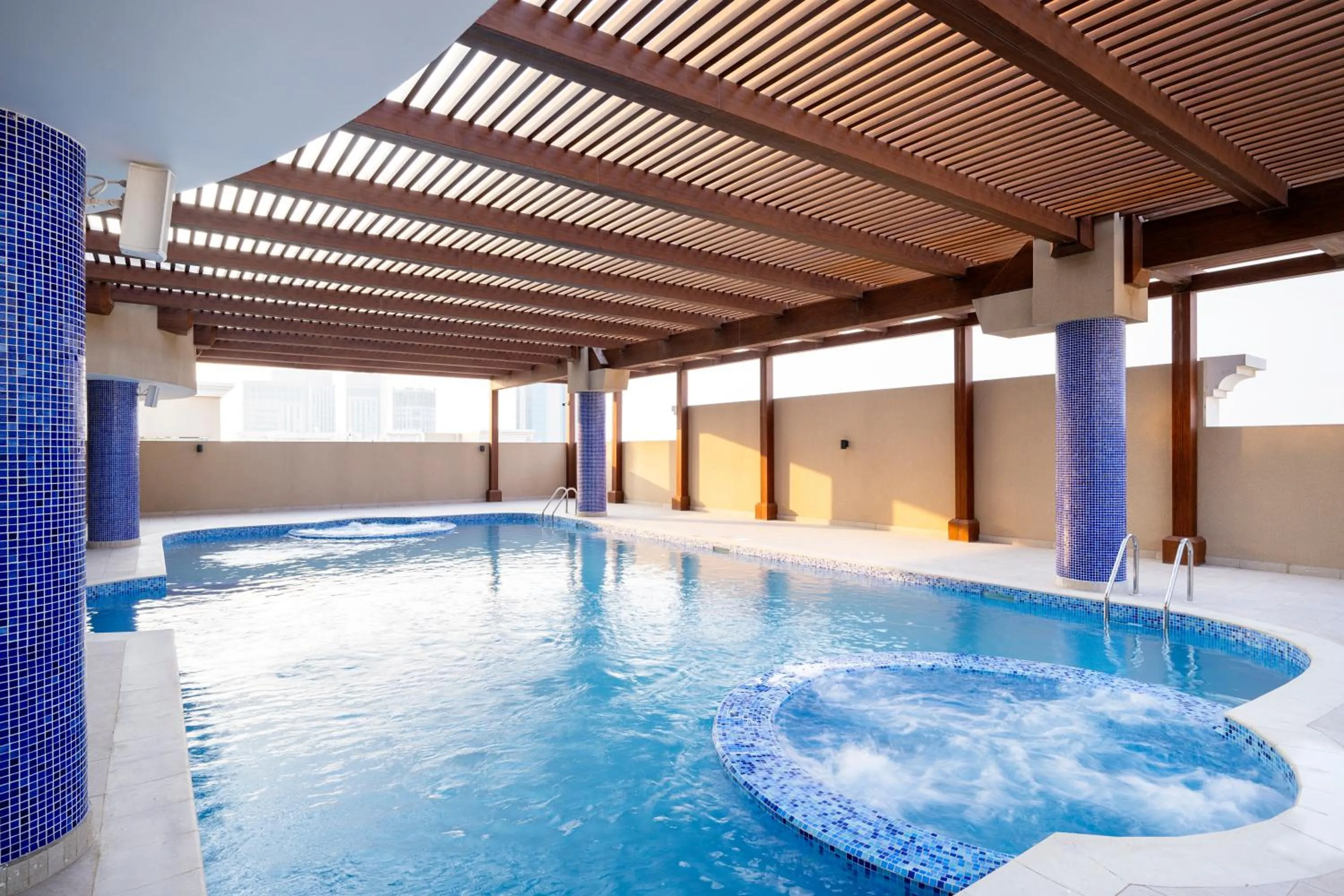 Swimming pool in La Maison Hotel Doha