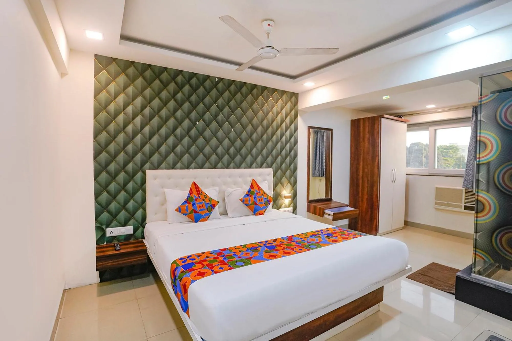 Bed in FabHotel Arsh Executive Inn