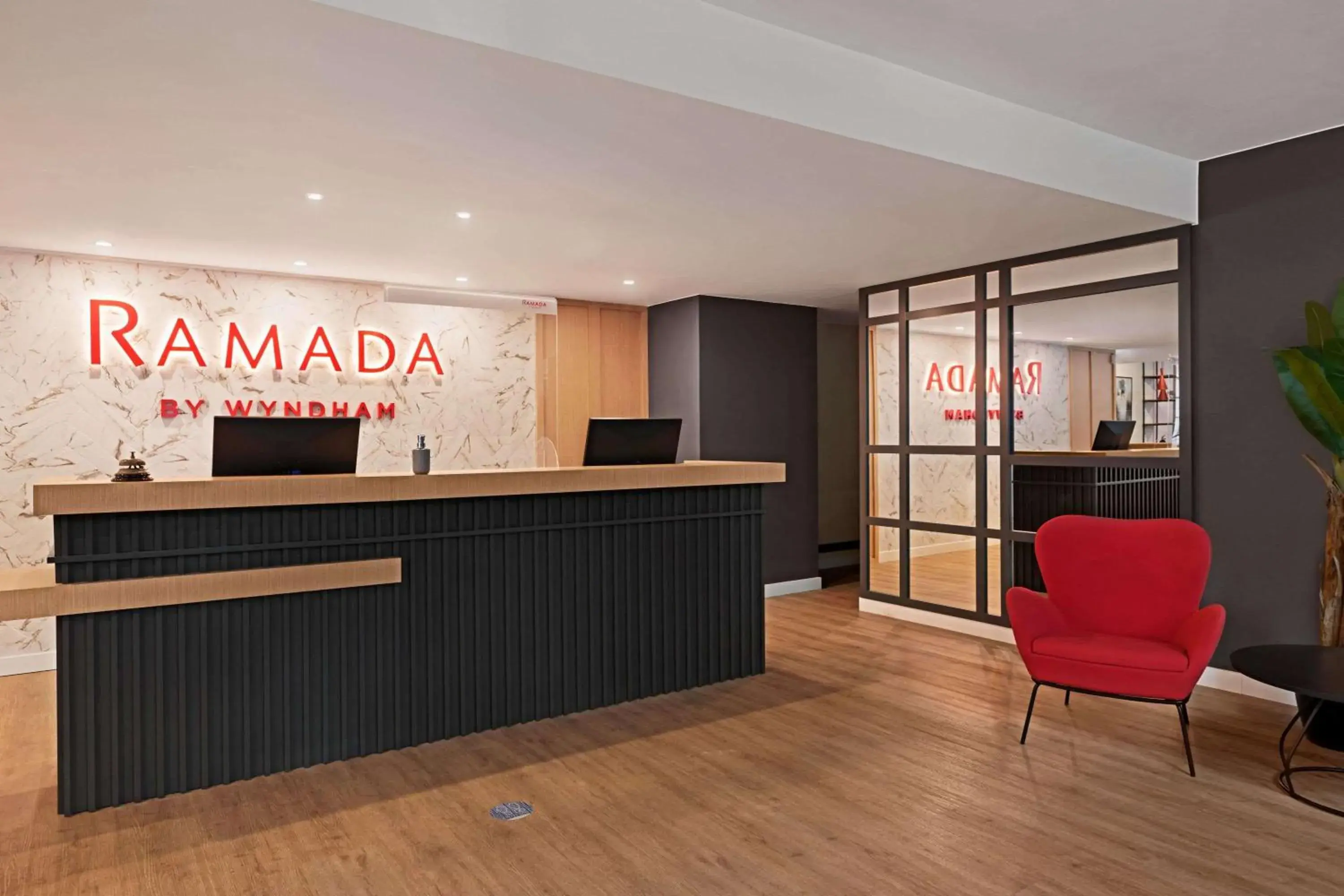 Lobby or reception in Ramada by Wyndham Valencia Almussafes Lobby or reception in Ramada by Wyndham Valencia Almussafes