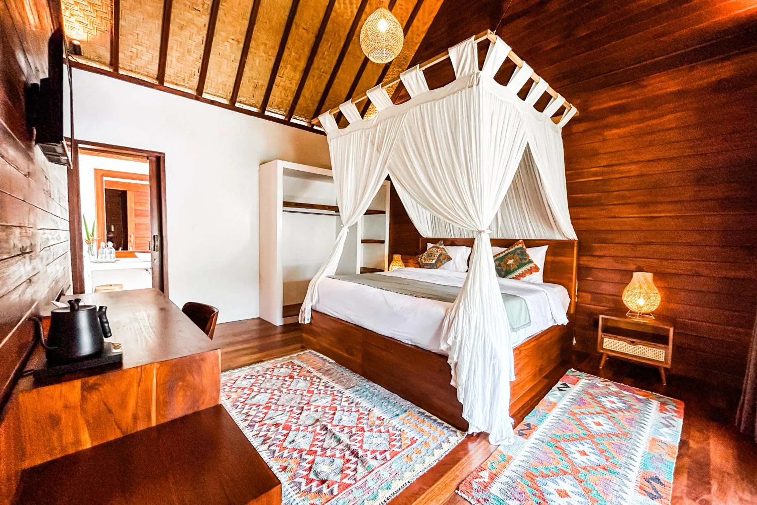 Bed in Kayu Mama Resort and Spa