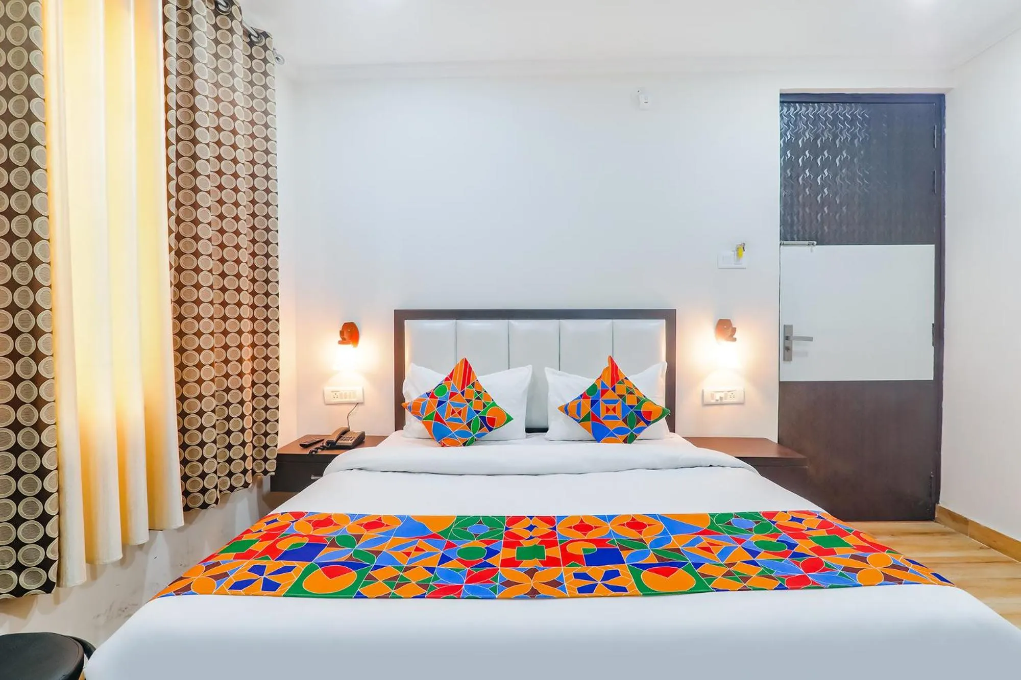 Bed in FabHotel Shyam Inn