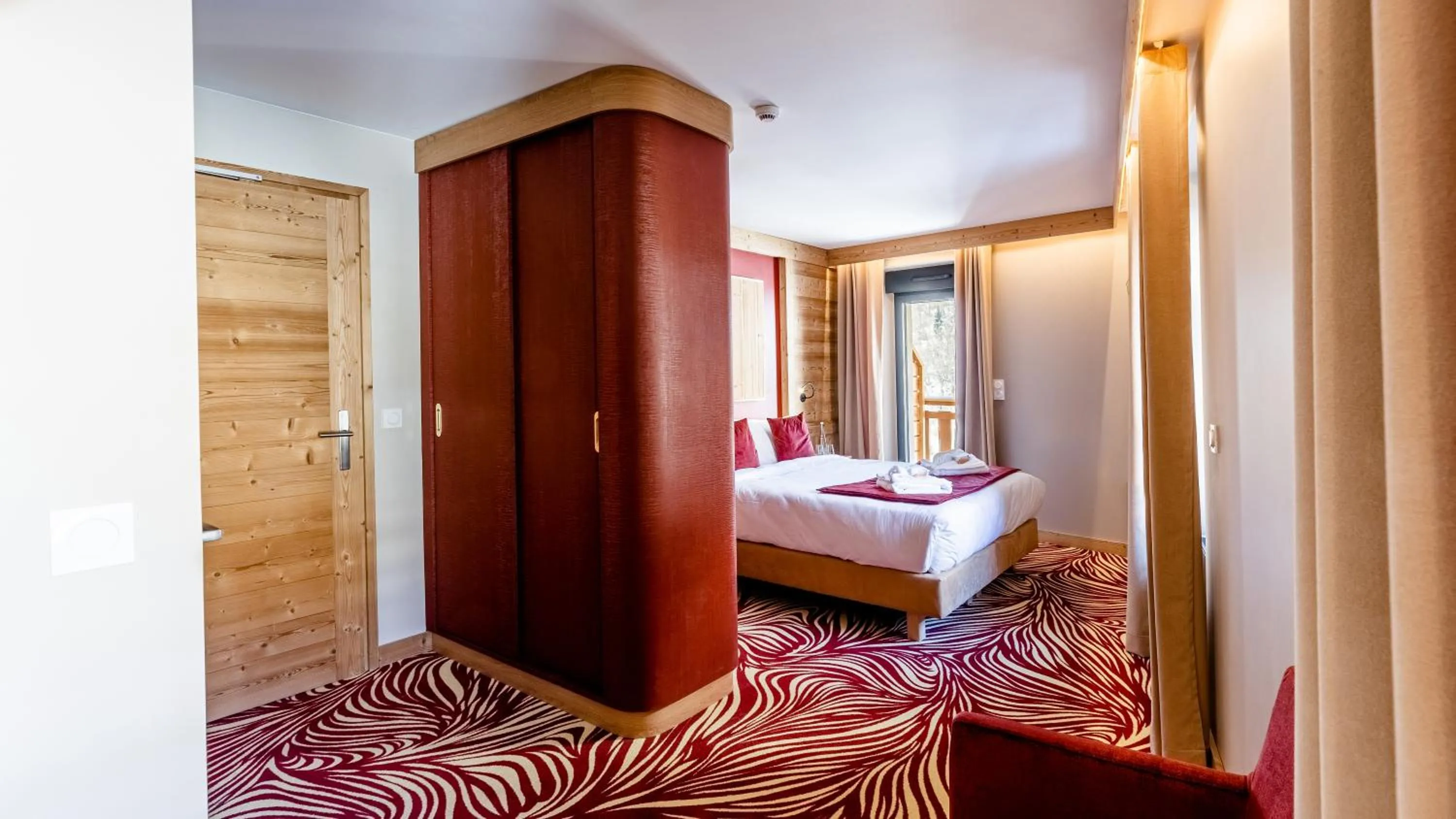 Bed in Madame Vacances Hotel Les Cimes