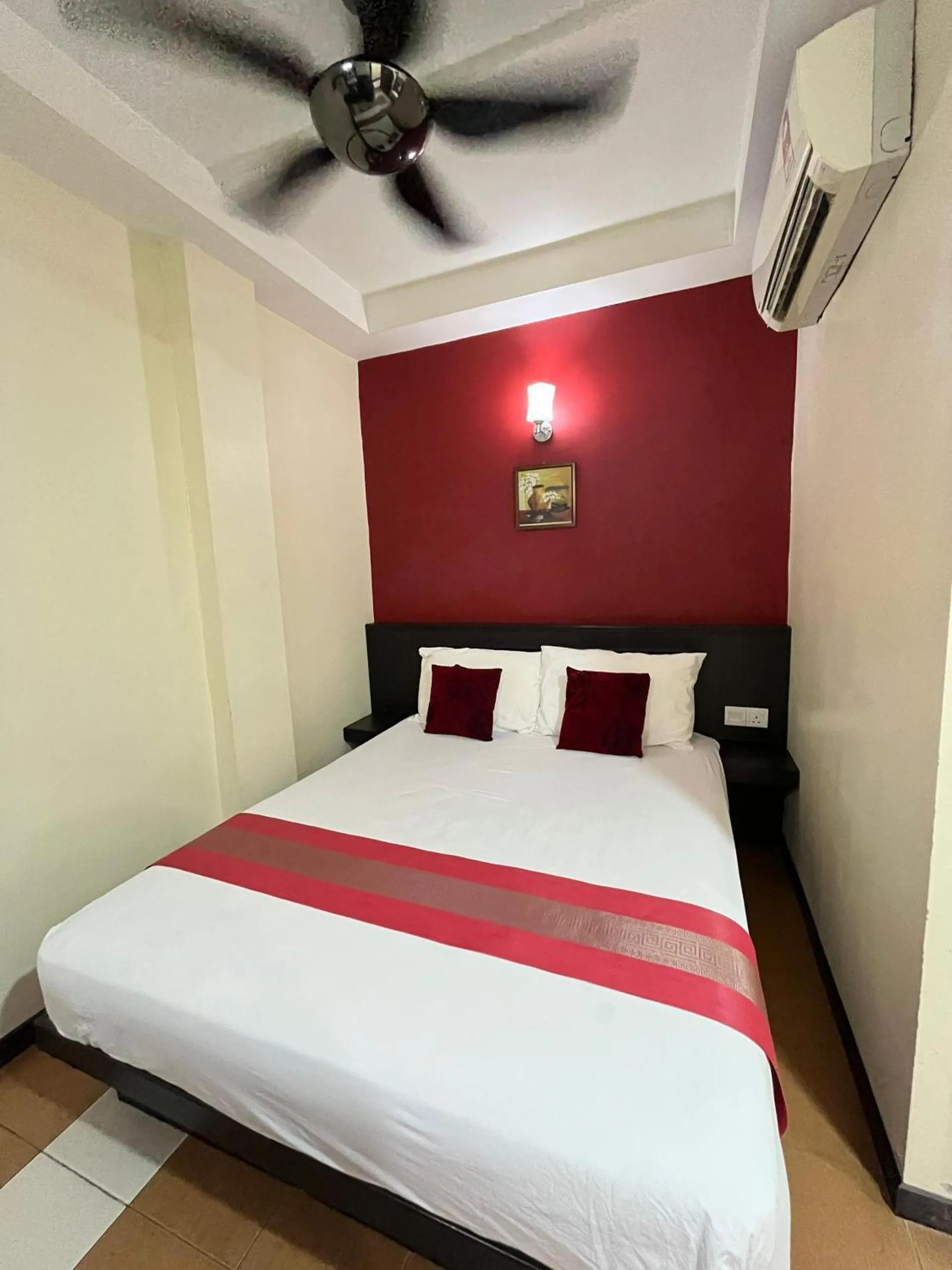 Bed in Sera Sentosa Inn